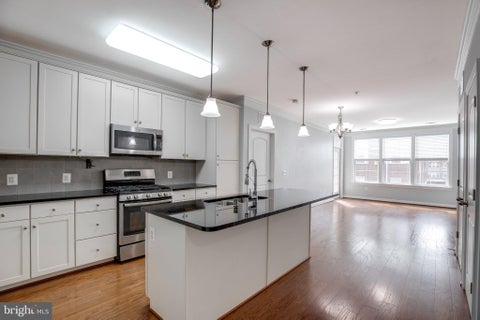 Photo of 13723 Neil Armstrong Avenue #305, HERNDON, VA 20171 (MLS # VAFX2339674)