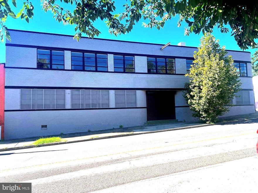 Owner Operated/Investor Opportunity. Fully renovated in July, 2025. Zoned I-1, industrial flex warehouse building. 2 levels, +/- 14,368 sq ft finished space situated on a fully fenced 0.42 ac lot. Inside the rear metal gate entrance are ample car parking spaces with 2 trailer spaces and a large detached storage space. The back entrance to the building from Hollins St has one loading dock and wide doors that lead to a huge open warehouse space, gas heating furnace, water heater and half bath. Portable A/C units on main level. Three additional warehouse spaces on left. On the right, there are more separate spaces with access to the basement, a second half bath and a second heating furnace. The front entrance from W Baltimore St is at a garage door  and a double door that leads to lobby space and kitchenette area. on either side of the front entrance are two spacious areas for office use overlooking W Baltimore St with secured glass windows.
Two stairways to the Upper Level, one at the rear entrance and the other from the lobby area. Upper Level has a huge open space that runs along W Baltimore St  with windows for the entire width of the building. Another spacious open space runs along S Catherine St. There is a third half bath at this level. 
The building has an excellent location close to Grace Medical Center, University of Maryland Medical Center, Port of Baltimore and BWI Airport. I-1 zoning has myriad uses. Please verify with Baltimore City zoning for your specific use.