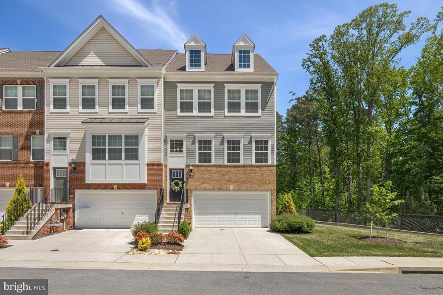 Welcome to this stunning 3-bedroom townhome offering a bright, airy open-concept design and thoughtfully upgraded living spaces throughout. The beautiful gourmet kitchen is the heart of the home, featuring quartz countertops, a huge center island with breakfast bar seating, a classic subway tile backsplash, and stainless steel appliances including a gas range and double wall oven. A spacious pantry and a dedicated coffee/cocktail nook add both function and charm. The adjacent dining area is filled with natural light from abundant windows and offers a sliding door that leads to a spacious deck—perfect for everyday living and entertaining.


The inviting family room flows seamlessly from the kitchen, and a convenient half bath completes the main level. Upstairs, you'll find an ideally located laundry nook,  three comfortable bedrooms and a full hall bath, along with plenty of closet space throughout. The impressive owner's suite features a tray ceiling and a private ensuite bath with a double sink vanity and a frameless shower with seating and shelf space. 


The finished lower level provides exceptional flexibility, including a full bathroom and a mudroom just off the garage. A large open area is ideal for a media room, home office, or guest suite, with a walkout to a gorgeous paver patio for added outdoor enjoyment.


Additional highlights include LeafFilter gutter guards and a 2-car garage. This home combines style, space, and convenience in a highly desirable layout.