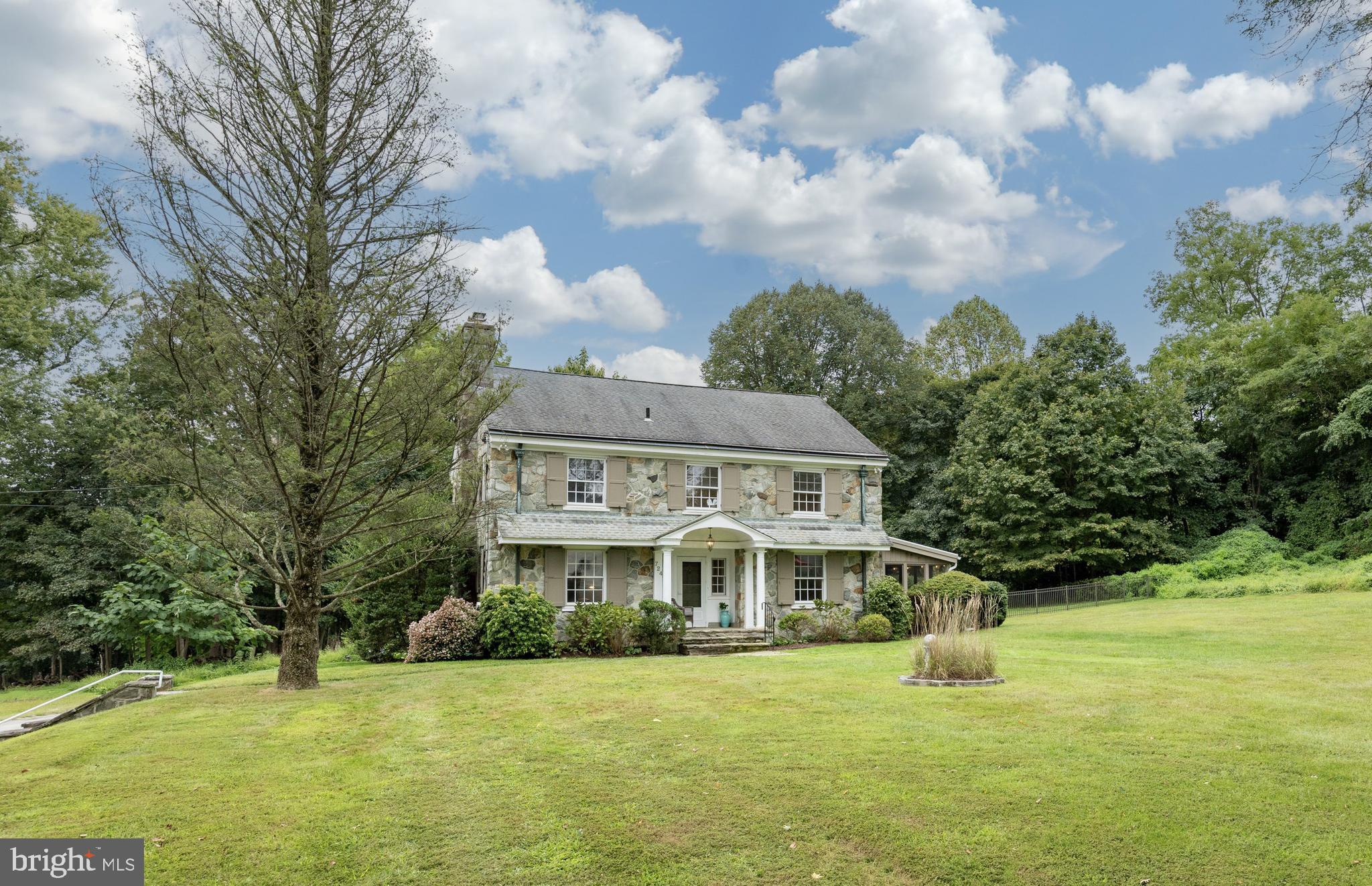 ‘Totally’ Handsome c1937 East Bradford Stone Colonial on a Private Lane, Nestled in a Mature Landscape and a stone’s throw to West Chester Boro! Elegant Proportions AND a Comfortable Spacious Living Space! 3000Sqft 4/5Bedrooms 3.1Baths .83acres Awesome Architecturals: Wide Window Sills, 9ft Ceilings, Warm Hardwoods, Spindled Staircase, Copper Gutters & Downspouts, Graceful Curved Walls & Arched Nooks, come discover more… Main Level: Portico Entry, Foyer, Living Room: Wood Burning Fireplace, Dining Room: French Doors open out to the Sun Room (my ‘fav’) & Entry to the Pool Patio/Terrace, Light Bright Kitchen: Breakfast Nook & Covered Porch, Back Hall: Powder Room & Pantry Closets, Office/Bedroom5 w/EnSuite Bath, Laundry Room. Upper Level: Primary Bedroom 18X14 & Classic EnSuite Bath, 3Additional Bedrooms, Hall Bath, BIG Walk-up Attic w/lots of Head Room. Full Basement, 2CAR Garage Vintage Cosmetics Good Bones So many Porches & Terraces to enjoy your morning ‘cuppa’ & evening Cocktails!