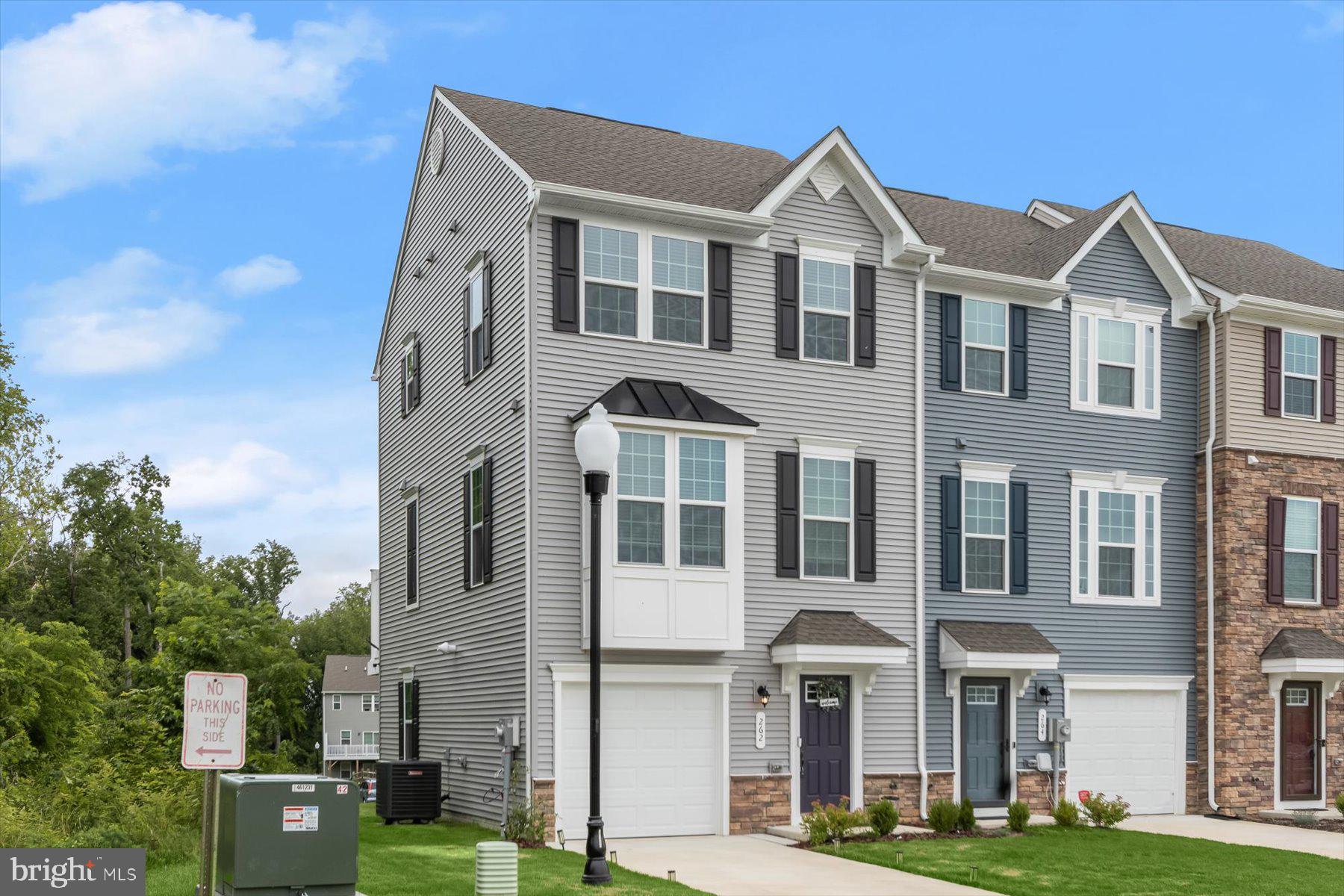 Nestled near parkland and positioned as a private end unit, this "like-new" garage townhome is ready for its new owner(s). Built in November 2023, this modern home boasts a spacious recreation room, a large living room, a contemporary kitchen, a Wi-Fi-enabled smart thermostat, a generous Trex deck, preferred gas cooking, an LED lighting package, and much more. Unlike older resale homes that often require extensive updates, this "like-new" garage townhome offers convenience and style, making it the perfect choice in a market with limited options.
When you arrive, there’s no need to hunt for parking. Your private driveway and garage are reserved for you, with additional community parking available for guests. The modern, maintenance-free exterior with stone accents allows you to enjoy your home without the hassle.
Entering through the front door or garage access, you’re greeted by a spacious entry foyer and a large recreation room with rear yard access. The main level features an expansive living room, a convenient half bath, a modern kitchen with a breakfast bar, and a sizable eat-in area that leads to your low-maintenance deck—perfect for outdoor living.
The upper level offers three bedrooms, including a large owner’s suite with a walk-in closet and a sleek bath featuring a shower and a double vanity. An additional full bath and a full-size washer and dryer complete the upper level for added convenience.
Don’t miss the opportunity to make this "like-new" end-unit garage townhome your home today!