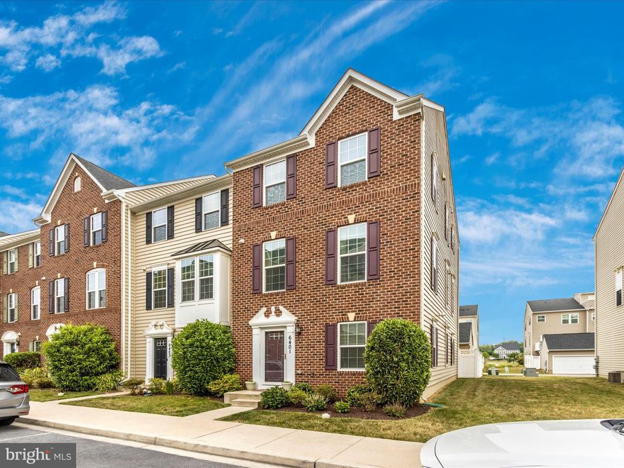 Welcome Home to this gorgeous brick-front Strauss townhome in the desirable community of Linton at Ballenger Creek! Inside is a large walk-out lower-level rec room with a fireplace, access to the rear yard, and an oversized garage: full bathroom and entry-level bedroom. The open-concept main level is perfect for entertaining guests!   A gourmet kitchen with a vast island. Beautiful 42" dark cabinets with soft close draws, granite countertops, backsplash, breakfast area, coffee bar with additional glass front cabinets, double-doored pantry for extra storage, stainless steel appliances, and separate dining area, all leading to the deck. Living room off the kitchen and half bath. On the upper level, you'll find an owner's suite with a sizeable walk-in closet and en suite bath with beautiful tile outlining the soaking tub, walk-in shower, and double vanity sink. Two spacious secondary bedrooms, a full hall bathroom, and a laundry room, complete the upstairs. Easy walk to the community swimming pool, clubhouse, and more! Conveniently located close to major commuter routes, shops, and restaurants! Take advantage of this one! Call for your showing today!