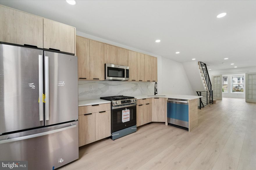 Welcome to this stunning and renovated 3 bedroom, 2 full bath home completed in 2025. Every detail has been thoughtfully designed with a modern touch, starting with neutral laminate flooring and fresh paint throughout.  The first floor features a gorgeous foyer entrance, neutral sand colored flooring and a  bright open layout.  The stunning kitchen boasts quartz countertops, stylish backsplash, European-style cabinetry, black accents, and stainless steel appliances including a gas range, microwave, refrigerator, and dishwasher. 
The lower level offers even more living space with a full bath showcasing beautiful oversized tiles and a sleek shower stall, along with a washer and dryer hookup and a separate utility room.  Upstairs, recessed lighting brightens each of the bedrooms, while the hallway bath makes a statement with chic gold accents.  This move-in ready home combines modern finishes with comfortable living spaces, creating the perfect place to call your own. Just a few short blocks to St. Joseph’s University makes this home a wonderful addition to your rental portfolio! Schedule your showing today.