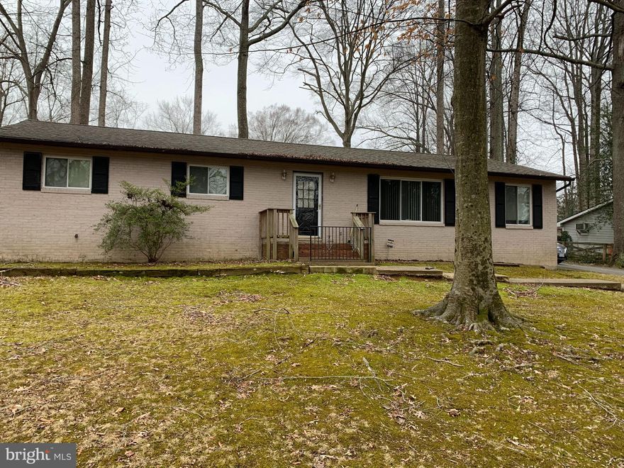 An investor's dream-With a little TLC, this one level rambler that sits on a half acre lot has 1680 square feet, and open kitchen and four bedrooms along with two full baths,  one in the master bedroom. The yard is on a corner lot with plenty of privacy. A paved driveway that also has a shed for extra storage, as well sliding glass doors with a deck that leads into the yard. All appliances will convey with the property and roof had been replaced in 2018. The owner wants to sell the property AS IS condition. No HOA and enter the property at the side entrance.  The Sentrilock box is located by the side entrance on the railing.