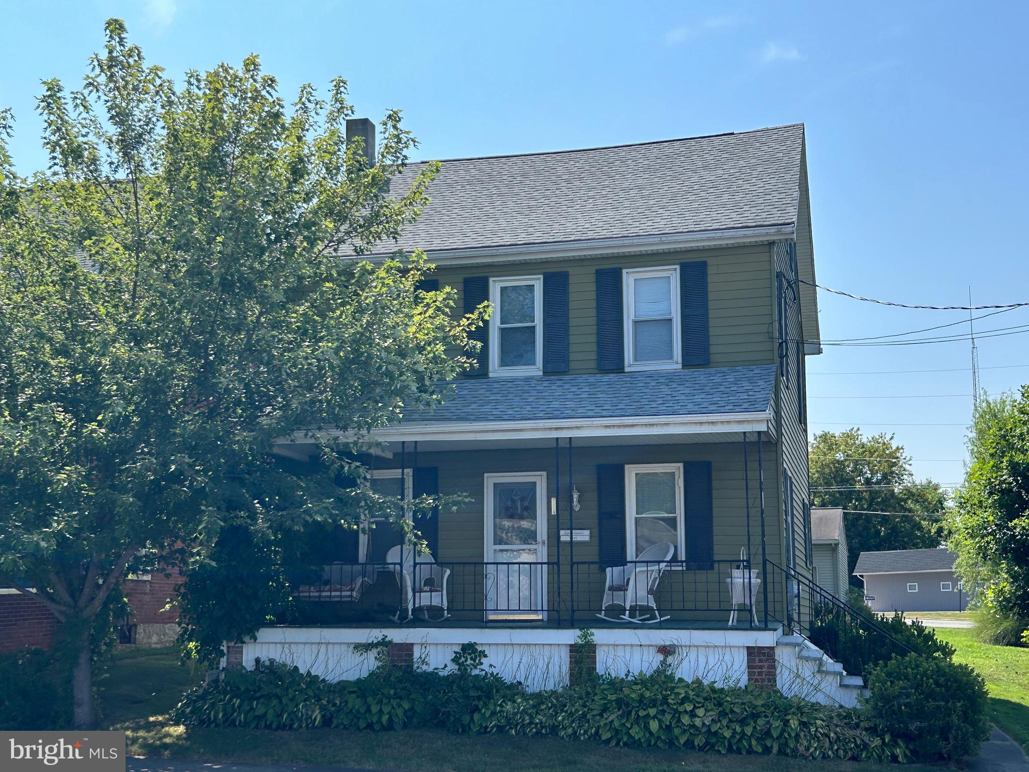 There' s more than meets the eye in this 3 or 4 bedroom traditional 2 and a half story! Welcoming front porch is the perfect spot to relax and watch the world go bye. The large living room has a ductless mini split to keep you comfortable all year long. First floor den/4th bedroom has an attached half bath. Newer kitchen cabinets create the heart of the home. Enclosed back porch houses the laundry area and additional storage. Upstairs you will find 3 bedrooms, the main bathroom, a secret storage closet and another ductless mini split. Walk up attic is divided into 2 rooms. But wait there is more! The detached 2 car garage is oversized, with a peg board wall, for your tools and a mower sized garage door that faces the house. Let your heart call this house home!