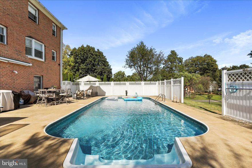 Enjoy summer living with this beautiful in-ground pool — perfect for relaxing, entertaining, and making memories right from your own backyard! Whether you’re hosting cookouts or cooling off on a hot day, this outdoor space is ready for fun all season long.  All-brick Colonial in the sought-after Rosemont District on 0.55 acres. New roof (2025) on both the home and garage! Versatile layout offers up to 5 bedrooms w/ 3.5 baths on 3 finished levels. The main level boasts two separate wood burning fireplaces, two dining room options, an office, and separate laundry room (with chute.) The kitchen is every chef's dream with an island, marble countertops, custom cabinets, stainless steel appliances, and gas range with custom hood. The primary suite offers a  walk-in shower, separate vanity, and cedar closet. Upper bedrooms contain  automatic closet lighting. The lower level has been professionally designed to entertain! It features an 11.2 built in surround sound system, hard plumbed gas fireplace, bar area with water hookup, and custom mantle & wall made of  2oo- year old, naturally stained White Oak hardwood and full bath with floor to ceiling tile and rain shower.  The lower level also opens to a private,  in-ground pool with newer liner and new pump!
In addition, the home also offers a rebuilt  electrical panel with surge protection (2025), solar panels on the home & garage (2025), and a tankless hot water heater (2020). Attached garage (currently home gym) is accessible from inside the home! Let your imagination run wild with the detached garage! This semi- finished space currently serves as an office, but is ready for the kitchenette and full bath to be completed to make it perfect for a rental, or in-law suite! We been told solar panels adjust your electric bill for a great savings.  Fenced rear yard. Convenient to shopping, dining, and MARC Train.