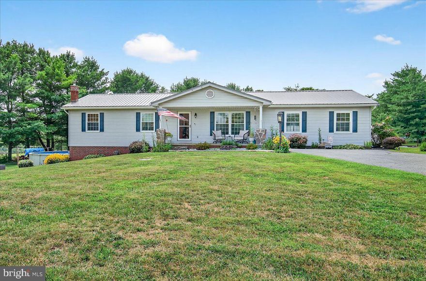 Welcome to this beautifully maintained country retreat nestled in the rolling hills of Hancock, Maryland. This charming home offers  three bedrooms and two full bathrooms, spacious living room with fireplace, separate dining area, and fully finished walkout basement. Outside you'll find an oversized detached garage, above-ground pool, as well as the front porch, patio, and deck - all perfect for enjoying the beautiful views! Peaceful location just minutes from town amenities and commuter routes, this property offers the perfect balance of rural charm and modern convenience. Property has been meticulously maintained and boasts many upgrades. Move-in ready and waiting for you to call it home.