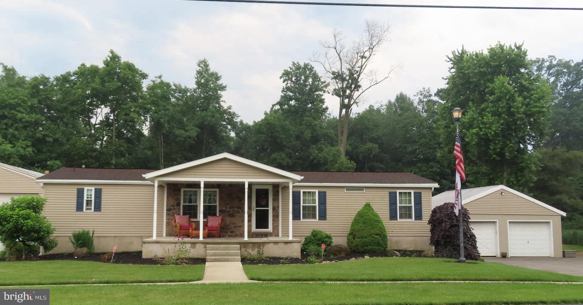 Wow lots to offer with 5 total bedrooms, 3 full Baths, this 1 story Double wide has been mostly all redone on the interior including recent painting thru out. This home is in very good to Excellent condition and has 3 bedrooms 2 full baths on the main level, stereo surround sound and home anti theft security system. Main level has a large living room, Family room with beautiful synthetic full wall stone with wood mantel and aesthetic fireplace, with window seats on both sides, ceiling fan sliding door leading to 10' x 20' concrete and paver combo patio with circular firepit. The main level has chair rail and crown moldings thru out. Primary bedroom has a full bath with granite counter top and walk in closet. There is a real nice 9' x 11' rear foyer entrance with pine ceiling and plastered walls leading to main and lower levels, The lower level has 2 bedrooms, full bath large 2nd full accessory kitchen/dining combination, and living room. The home has a 200 amp electric service, updated thermo tilt in double hung windows, 12' x 19' covered front porch, 14' x 19' separate screened in patio area, 24' x 24' Block 2 car detached garage, The other block shop building is 36'w x 48' L x14' H, with a 2 ton engine hoist, 12' x34' 2nd level storage, each overhead access door is 13' 8" w x 14'h, there is also a 16' x 24' x8 'h block office area, the block building has a separate electric service, the  combined black top paving areas would accommodate 40+ parking with dusk to dawn lighting, there are also an 8'x8' and a 10' x 11'6 storage building. Items included with this sale are : All window treatments, Exterior awnings, hot tub on rear patio, main level refrigerator, range/oven, built in microwave, Bosch Dishwasher, washer & dryer, Lower level: stove and refrigerator