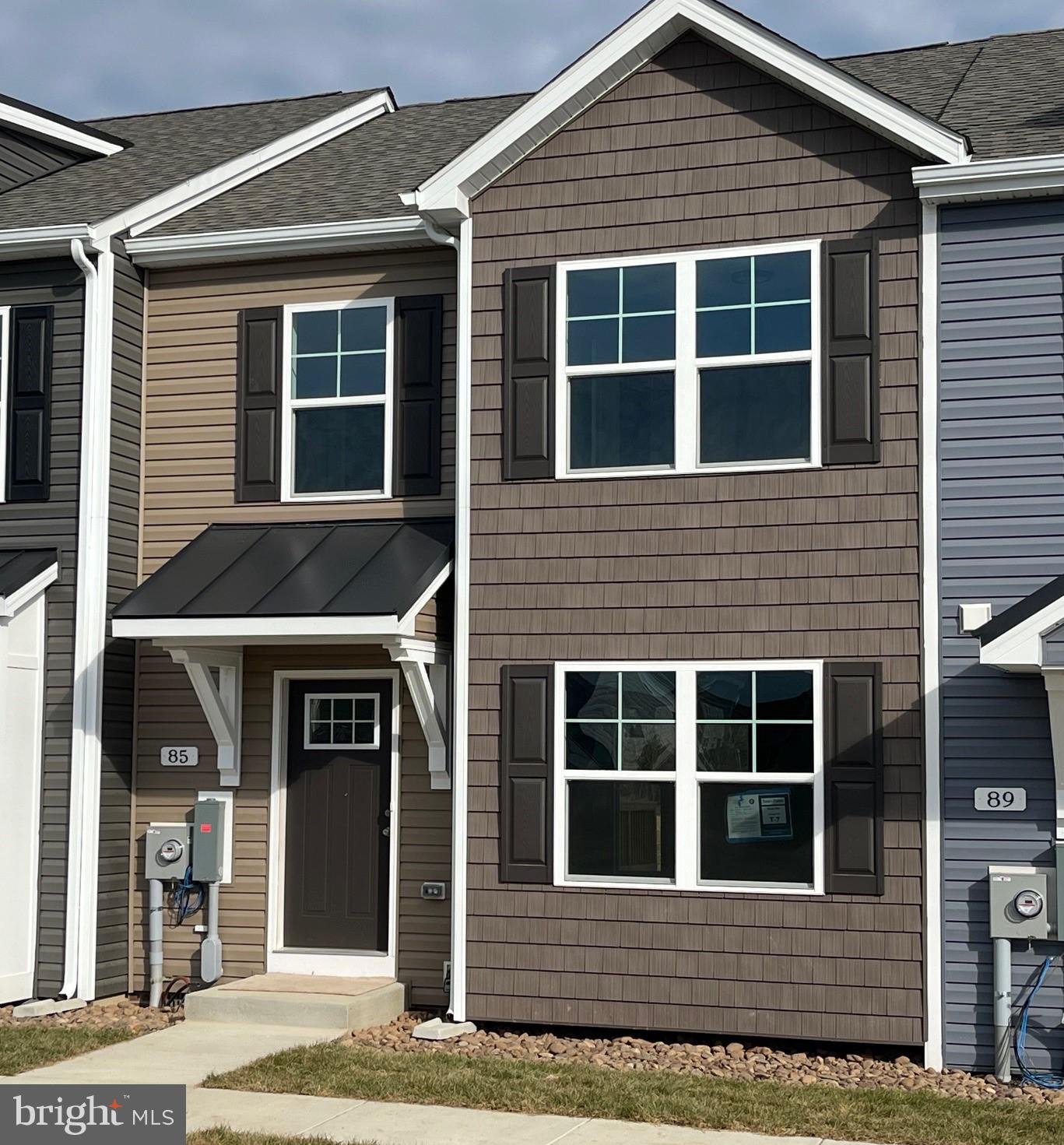 Under Construction. 3 bedroom, 2.5 bath 2-Story town homes featuring spacious room sizes, luxury vinyl plank flooring in main living areas, Bump out in main level family room, and kitchen with island, granite countertops, and pantry. The Primary Bedroom has walk in closet and full bath with double vanity and tile shower w/ glass door. All homes come with natural gas heating system and brick accents on front. 10x12 Rear deck included and builder pays 3% closing assistance. Photos are similar construction