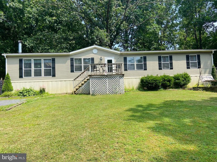 BACK ON THE MARKET due to no fault of the sellers!  SELLERS HAVING NEW ROOF INSTALLED!  This adorable and well priced manufactured home on almost 3 acres has been converted to real estate!  That's right, the foundation was made permanent in 2021!!  This home is deceiving because once you step inside you are totally shocked by the size!  Open concept kitchen and living room with a very large separate dining room and seating area.  The rooms are all a generous size.  The kitchen has newer flooring and paint.  Come and bring your style and charm to this country charmer and make it your own!