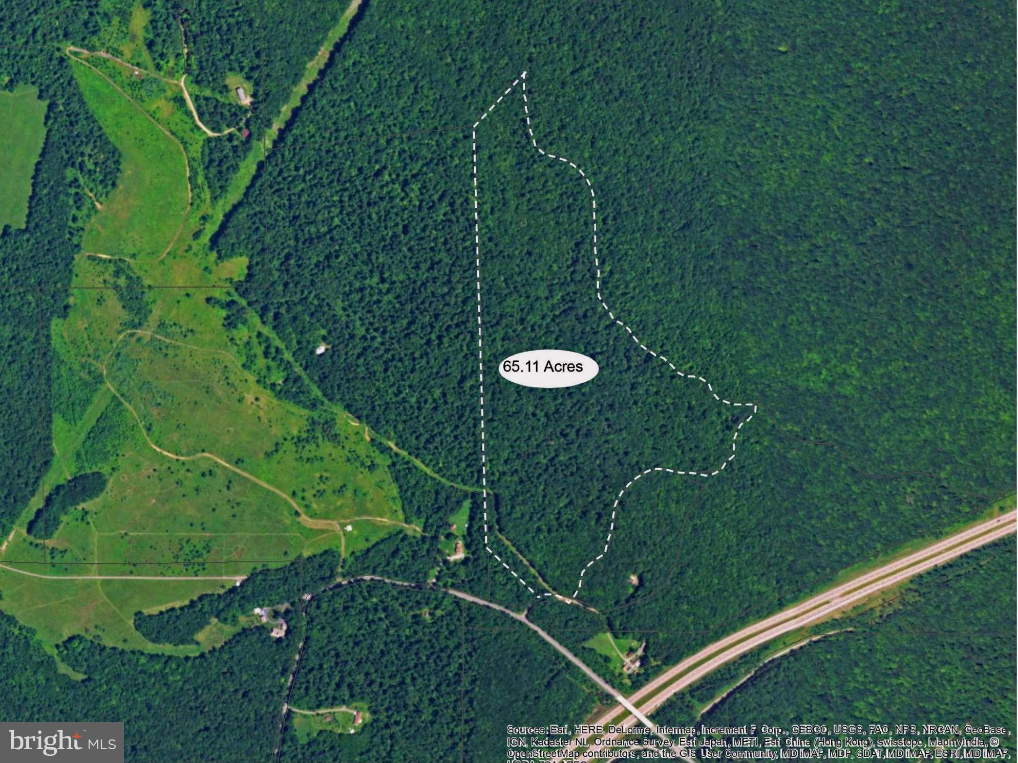 65.11 +/- Wooded Acres fronting 1/2 mile on Mill Cove Run Stream off Old Morgantown Rd. No HOA or restrictions . Gentle rolling property offers Private Park Like Setting, 15 minutes to Deep Creek Lake & Wisp Resort Recreation areas, 5 minutes to Interstate 68 near Friendsville. Perk approved w/ Drilled Well ready to build your Primary or Getaway home. Plat available. .