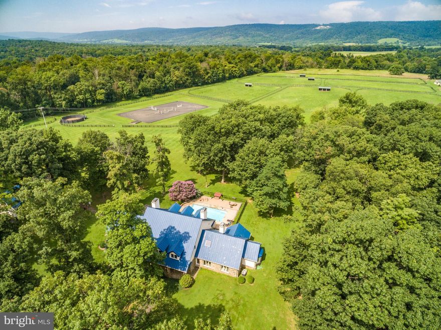 Enjoy serene Country Living  in HUNt COUNtRY on this 94 acre Horse Farm  with beautiful Blue Ridge Mountain Views   Updated, open and airy  4+ Bedroom, 4.5 bath  Main House  with large Kitchen and adjoining Family Room with huge gas Fireplace,  Main level Master Bedroom with Fireplace, and adjoining study/office; second Bedroom also on main level; second floor family room/office/library ; wood floors throughout; walls of windows that take advantage of the vistas ; Pool+  Hot Tub; Fire pit + Built in Grill; 6 Fireplaces total;  2 Family Rooms.  Next door: 2 car detached Garage/  Guest House: 1 Bedroom+ Office, kitchen and sitting room;  8 stall center aisle Barn; 4 stall 2nd Barn;11 Paddocks;Run-ins; 150' x 200' Arena! 2 Bedroom Log Cabin presently rented. VeryPrivate but  this wonderful location is minutes to Middleburg /Upperville Show Grounds ,Rt 50 &  7.Property has  versatile uses- if not a horse person rent the small barn and log cabin(Presently rented  for $2450 a month); have another tenant in Main Barn with 8 stalls-- a great set up for  serious equestrians and their horse operation!   Family Compound; or a perfect country get-away-for weekends or full time use- Make this your Refuge   away from the hustle and bustle of  life today.  For Appointments please follow rules of  coronavirus safety  by wearing masks . 
Please also look  under Farms  MLS# VALO421002 for additional photos and information