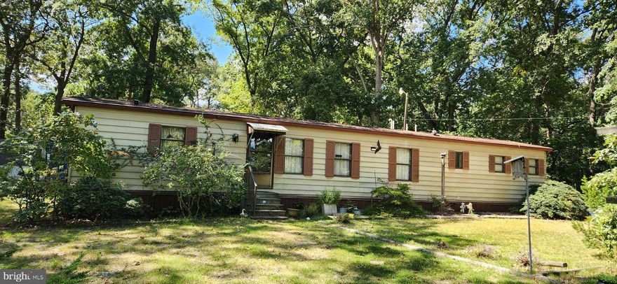 What a nice location, last home on the block overlooking mature trees and marshland! Nicely maintained mobile featuring a spacious yard, newer roof and a/c, oversized kitchen, and two sheds for all your beach equipment. The property is in walking distance to Riverdale's private beach and pier. Plenty of room for a deck or screened in porch to enjoy the peaceful surroundings. Purchase based upon park approval, no sub-leasing. Reasonable lot rent!