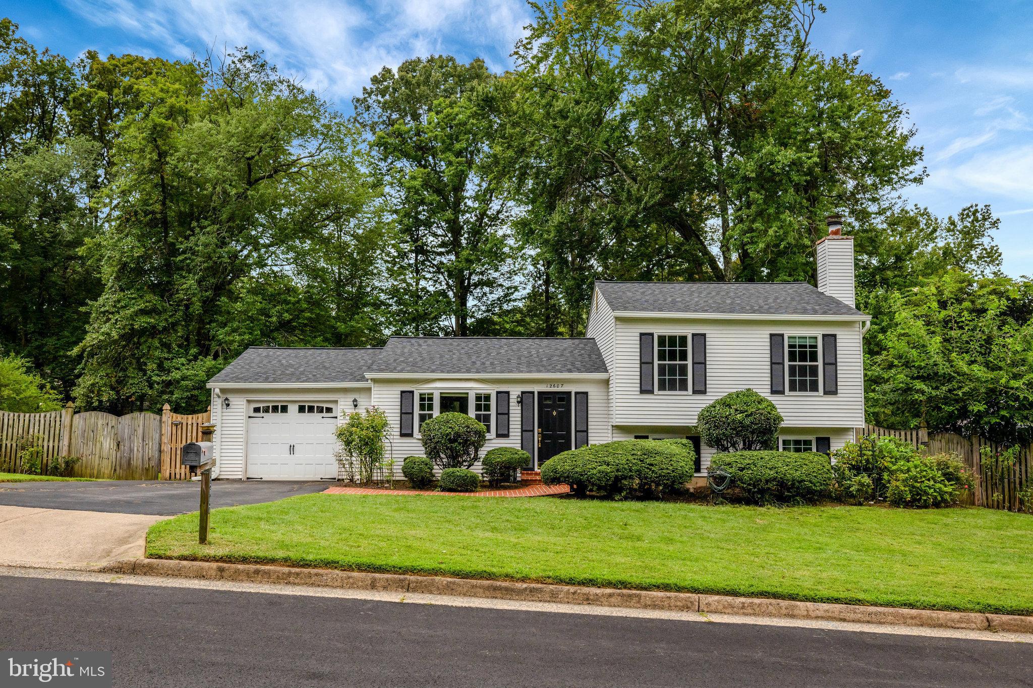 Welcome to this beautifully updated 3-bedroom, 3-bathroom home in the Glenbrooke Woods Community. Come inside to discover gleaming wood floors on the main level and step down to a spacious living room featuring a wood-burning fireplace, built-in entertainment center with surround sound, and direct access to a dedicated home office—ideal for remote work or study.
Upstairs, three generous bedrooms and updated bathrooms offer modern comfort.
The chef’s kitchen is a true highlight, boasting stainless steel appliances, custom cabinetry, granite countertops, a pantry, and a seamless flow into the dining room. From here, step out onto the deck and enjoy the expansive, fully fenced backyard —perfect for outdoor entertaining and family fun.
This home is ideally situated just minutes from Dulles Airport, major commuter routes (Fairfax County Parkway, I-66, Hwy 50), and local amenities including Reston and Fair Oaks Hospitals, premier golf courses, Frying Pan Farm Park, and the Air and Space Museum.