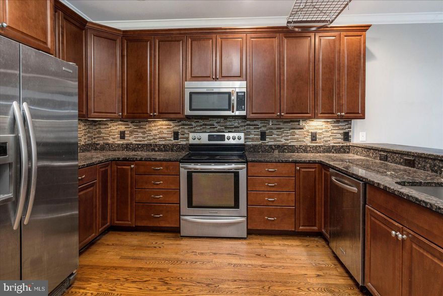 Service warranty included by the owner alongside traditional property management maintenance. Two owners suites with full baths in each. Private one car garage with an additional parking pad for two vehicles total! This beautiful townhome is in the heart of the city, moments away from Patterson Park and entertainment, shopping, and dining! A private one-car garage with a parking pad allows for 2 personal parking spots in a city where parking is constantly a battle! Enter into the entry-level entertainment area featuring built-in bookcases, wine storage, wet bar, and convenient access to the one car garage. The main level provides a living and dining room that is highlighted by a large window, and hardwood floors that continue throughout. Large kitchen for cooking meals boasting a sizable double door pantry, 42” soft close cabinetry, glass tile backsplash, stainless steel appliances, and granite counters. Relax and unwind in the owner’s suite offering access to a private deck, double closets, tray ceiling with cove lighting, double vanity, and a luxurious ceramic tile walk-in shower. Enjoy the mornings on one of two balconies. Major commuter routes I-95, I-895, and US-40. Owners require a 600+ credit score.