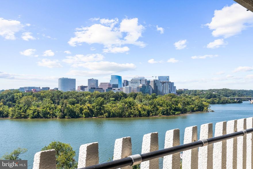 Sweeping, unobstructed views of the Potomac River, Key Bridge, Roosevelt Island, Georgetown Waterfront, the Kennedy Center, and spectacular sunsets surround this stunning residence. With 2,690 square feet of interior space and over 500 square feet of balcony, the home is wrapped in floor-to-ceiling windows that offer breathtaking vistas up and down the river from every main room. This rare and highly desirable floor plan flows naturally with the contours of the river, creating a seamless connection between indoors and out. The layout includes 4 bedrooms, with one converted to a  library/den featuring a custom-designed bar area. The spacious, open-concept living and dining room is perfect for both everyday living and elegant entertaining. A large chef’s kitchen offers ample space for culinary creativity. The smaller bedroom is thoughtfully separated from the others, making it ideal for a private guest suite or a quiet home office. The monthly fee covers all-inclusive living—property taxes, all utilities, HVAC maintenance, basic cable, internet. Watergate  amenities are second to none: 24-hour front desk and doorman, outdoor saltwater pool with grilling area, newly renovated fitness center and community room, rooftop terrace, dog spa, beautifully landscaped gardens, and on-site shops and dining. Unbeatable location with a high Walk Score—steps to the Foggy Bottom Metro, Kennedy Center, Whole Foods, Georgetown Waterfront, and more!