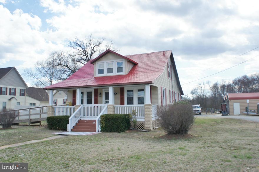 Commercial Office Building-Perfect for small office needs! NEWER ROOF & WINDOWS! FIRST floor includes receptionist area & conference room, 2 Office and, bath. Upstairs & lower level storage. Two sheds, ome garage & One open machine shed. Perfect for contractors! Great location with Great Signage!