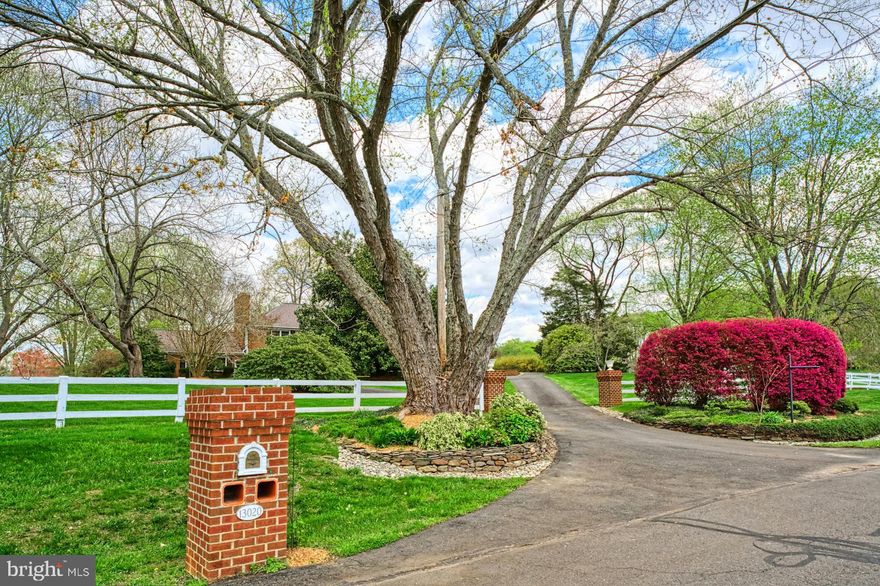 This magnificent 4 Bedroom, 4 Full Bath home, just north of the Historic Town of Clifton, is perfectly situated on a flat lot with amazing views of the open pastures, mature trees and professional landscaping.  Inside, enjoy all the comforts this home has to offer from the indoor/outdoor living spaces to its heated floors, crown molding, high-end systems and so much more. From the Foyer, you will be greeted by the Formal Living Room with gas fireplace. Across the Foyer is the well-appointed Dining Room leading back to the grand, Gourmet Kitchen – a chef’s dream including stainless steel appliances, designer gas cooking range, double ovens, refrigerated drawers, two sinks, beverage refrigerator and grand built-in refrigerator. The large island is great for entertaining while the wall of built-ins provides tons of extra space to serve your guests. For your outdoor needs, the patio is steps away through the screened porch allowing the kitchen doors to remain wide open. The huge Family Room has heated hardwood floors, a wet bar, built-ins and a gas fireplace.  The outside comes to life through the double sliders flowing to the four-season room with flag stone floors. The main level is complete with a Full Bath and Mud/Laundry Room. Ascend the gorgeous stairs to the upper level where you will find the grand Primary Bedroom and Bath. The attached room can be used as a 5th Bedroom/Office or Closet. Three large Bedrooms share the Hall Bath with Shower Tub. The Lower Level boasts a large Recreation Room, Bonus Room/Gym, Full Bath and lots of room for storage or a workshop. The outside is amazing with its professional landscaping and plenty of space to roam.  Imagine entertaining on the oversized flagstone patio, playing a game of basketball or pickleball with the family or simply watching the nearby horses from the Cloverleaf Equine Center. The two-stall barn is perfect for horse lovers or can be converted to meet your needs. All of this is conveniently located to the shops and restaurants of Clifton and Fairfax, the many local parks and golf courses, and the arts of George Mason University. Welcome Home!