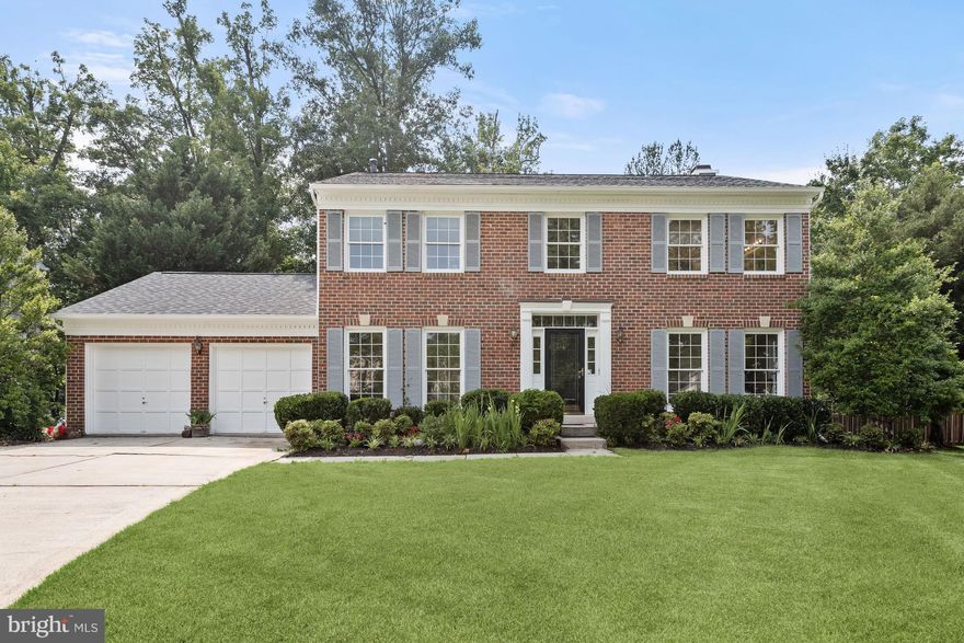 This beautiful brick exterior colonial settled on a cul-de-sac amongst mature trees and in the Greenbelt Woods community of Lanham!  Arrive into this traditional and sophisticated floor plan and let the foyer that offers a two story ceiling, crown molding, and guides you into the formal dining and living rooms.  Entertain at the highest level in the living room adorned by floor to ceiling windows and gorgeous hardwood floors that brings a warmth and tranquil atmosphere.  Enjoy gourmet meals in the dining room featuring a chair railing and allows for a seamless transition into the kitchen for convenient access for hosting any special occasion.  Let the kitchen inspire delectable delights boasting a center island with breakfast bar, a breakfast area for morning coffee or tea, stainless steel appliances, and granite counters.  The spacious family room that is off the kitchen is ideal for spending time with family and friends enjoying a movie or book curled up in front of the gas-burning fireplace with built-in bookcases accented on either side.  Relax and unwind in the primary bedroom suite highlighted by a vaulted ceiling, a walk-in closet, and a soaking tub for  truly tranquil moments after a long day.  Three additional bedrooms and a hall bath complete the upper level sleeping quarters.  A fully finished lower level awaits as a recreation, game, or music room adorned by modern flooring as well as an office or possible bedroom.  Take part in the outdoors with a four season sunroom adorned by a cathedral ceiling, skylights, and a palladian window.  A two-car garage and major commuter routes I-495, Greenbelt Rd, and Baltimore Washington Parkway for easy access to points of interest truly make this a must-see property!