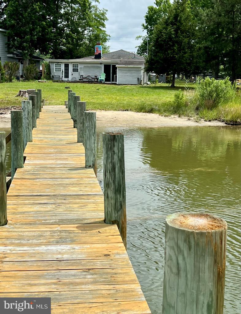 Just a Little TLC and Updating and this Waterfront Gem will Come back to Life ! Located in the Quaint and Peaceful Neighborhood of Pine Point Estates, this is a great location. A Very livable 3 bedroom, 2 bath home with some projects already done and a few more to complete. Enjoy as you transform this cottage into your own vision. Some great Features: open floorplan for entertaining, gorgeous brick fireplace as a focal point, Classic Knotty Pine walls, a sunroom, nice sized kitchen, fenced yard, storage Sheds and more ! Located on TWO WATERFRONT PARCELS with a Very Nice Pier and a small private beach! This is a tidal Pond with a narrow entrance to the Potomac accessible by Canoes and Kayaks. Within a short walk, The Community Offers Numerous boat slips, Picnic Area and boat ramp all on Cod Creek overlooking the Potomac River. Make this home your own at an affordable Value !