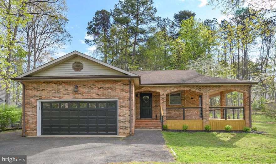 Back on the market due to no fault of the sellers! You will be thrilled with the water views, brick architecture, and detail of the wrap around porch that welcomes you to 103 Riverdale Lane!  This beautiful home is located near the front gate and steps away from the marina.   The openness of the floor plan with tall ceilings, skylights and gorgeous flooring will wow you.  The kitchen is delightful with upgraded stainless steel appliances and open to the living room to make spending time with family or entertaining a breeze.  The master suite is complete with en suite bath and walk in closet.   Enjoy relaxing on the screened porch after a long day with your favorite beverage.  In addition, the level lot would be perfect for flower gardens  and outdoor fun! A private, gated, secured community, Lake of the Woods offers anything and everything you could possibly want. Home to two lakes (the 550 acre main lake and a 35 acre "fishing lake"), a golf course, an equestrian center, a fire and rescue department, and a church all within the gates, Lake of the Woods simply has it all. Whether your passion is boating, water skiing, kayaking, golfing, horseback riding, or simply taking in the breathtaking views from the clubhouse while enjoying a fabulous meal, from your own deck or yard, or from one of the beaches, you won't be disappointed! Perhaps you'd like a game of bridge or volunteering your time and talents...Lake of the Woods offers more than 60 clubs and/or organizations from which you may choose to become involved. Located in Orange County, we are fortunate to enjoy low real estate taxes. Coupled with home prices ranging from $150,000+ to over $2,000,000, Lake of the Woods is the perfect community for both full-time residents, as well as weekenders. But don't take my word for it, please come see for yourself! I will gladly give you a tour of Lake of the Woods by boat and by car so that you may experience why I love Lake of the Woods!