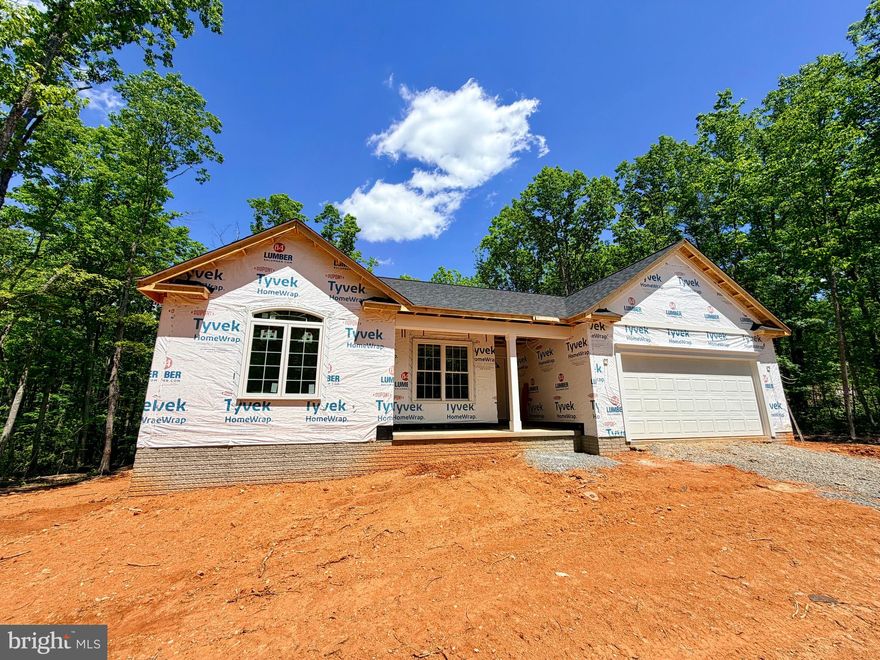 UNDER CONSTRUCTION! CHARLESTON II MODEL - LOT 6- Located on a lovely 4.84 acre mostly wooded lot. Home will include an open floor plan with Stainless Steel Appliances and Granite Counter Tops in kitchen, Cultured marble vanity tops in the bathrooms, Covered front porch, Unfinished Basement with bathroom rough-in for future expansion and a 2 car garage. Call for more information or to schedule a showing! Road Maintenance Agreement. MID-JULY COMPLETION DATE!