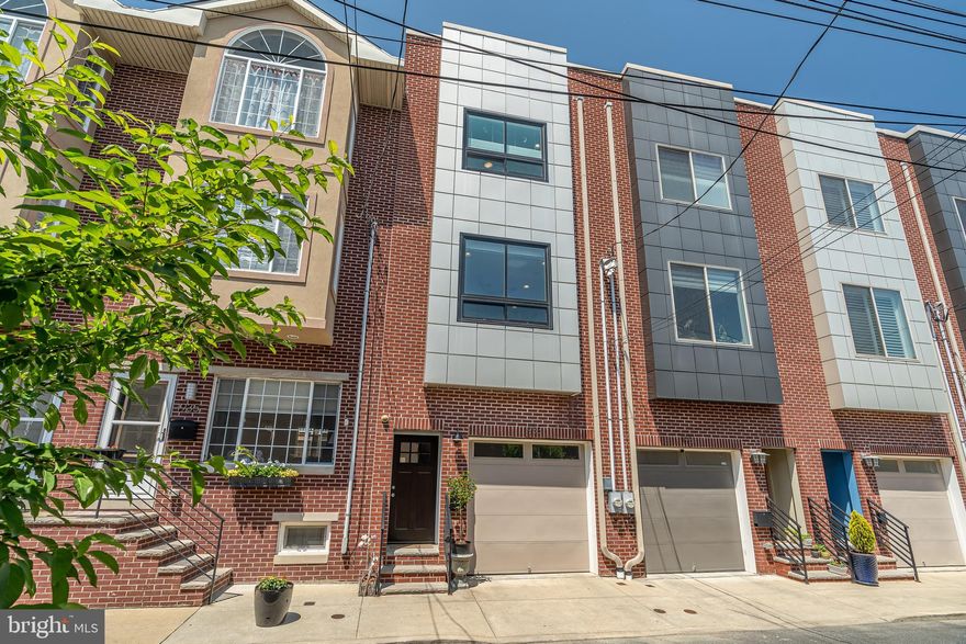 Welcome to 1933 League! A gem found in Graduate Hospital - southwest of center city. On a quiet, tree-lined street, this contemporary townhome sits. Enter this southern facing home through the inviting façade. Boasting a spacious interior of over 2000 square feet, with rooms that allow for versatility and creativity to meet your unique needs. With 3 bedrooms and 4 bathrooms, guests always have a place to stay. Kitchen and dining equipped with contemporary finishes and luxury appliances. 2 roof decks allow for 360 degree views of the city great for entertaining and relaxing day or night. The best feature, however lies in the much needed 1-CAR GARAGE PARKING space, seldom found in the city. Over 3 years left on the tax abatement. Improvements made on the home while maintaining its originality and design. Whichever level of the home you are on, you will find space and convenience. Nearby, are the neighborhood's small businesses which include local restaurants, pubs and shops. A very familiar area for those commuting to Penn's campus as well as Center City.