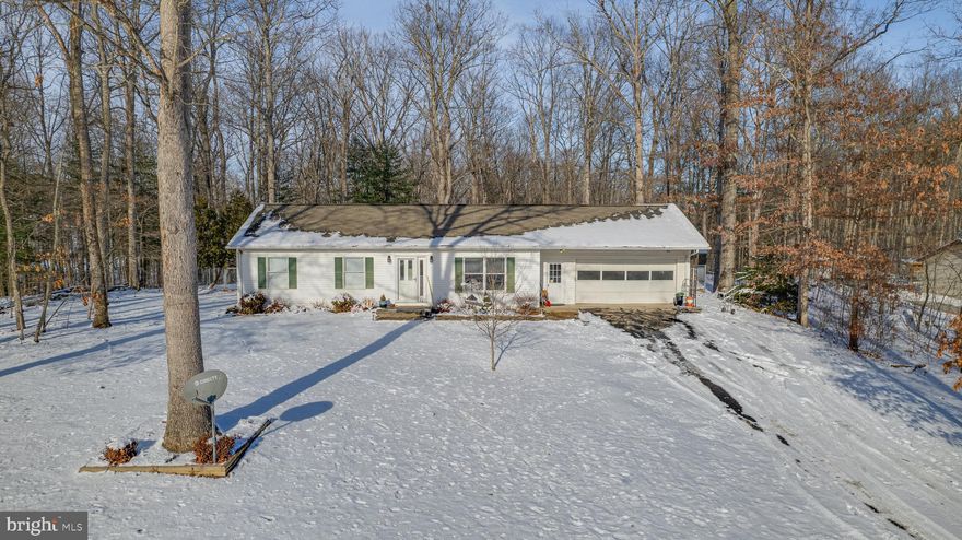 Cozy and comfy is this sweet rancher located in a small subdivision on over a half an acre lot. Just off of Back Creek Rd and close to Rte 9, this home is minutes from Hedgesville, I-81, hospitals and shopping! Don't miss this opportunity to live in an area so close to the action yet feels so far away once you are home. Large back porch with plenty of space for a grill. The backyard is fenced in to keep your little ones and critters safe. Lots of room for a swing, slide, slip and slide, garden, etc. Storage shed is also onsite. Large two-car attached garage so you can park more than just your cars. This home is perfect for those needing to downsize or looking for their first home.