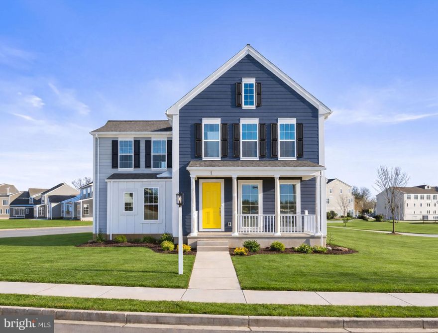 Welcome to the perfect blend of space, style, and smart design. This 6-bedroom, 4.5-bath home offers 3,680 square feet of flexible living in the desirable Cumberland Valley School District and move-in ready. From the oversized front porch, enjoy sweeping views of The Homestead and timeless curb appeal with Hardie Plank siding in Aged Pewter, white accents, bold black shutters, and lush landscaping. Inside, 9’ ceilings and 8’ doors elevate the space, while luxury vinyl plank flooring flows through the main level. The open-concept design connects a bright great room, dining area, and chef-inspired kitchen with two-toned cabinets, quartz countertops, walk-in pantry, and tile backsplash. An oversized eat-in island makes weeknight meals and weekend entertaining a breeze. A private first-floor bedroom with full bath offers an ideal guest or in-law suite. Upstairs are 5 more bedrooms and 3 full baths, including a junior suite with private bath and a luxurious primary suite featuring a spa-style shower, large-format tile, and walk-in closet. The lower level offers space for a game room, gym, or wet bar. Enjoy a laundry room with built-in cabinets and sink, plus an oversized backyard for relaxing or entertaining. Grange features preserved spaces including a wildflower meadow, green areas shaded by century-old trees, walking trails, and gathering spots perfect for connecting with friends old and new.