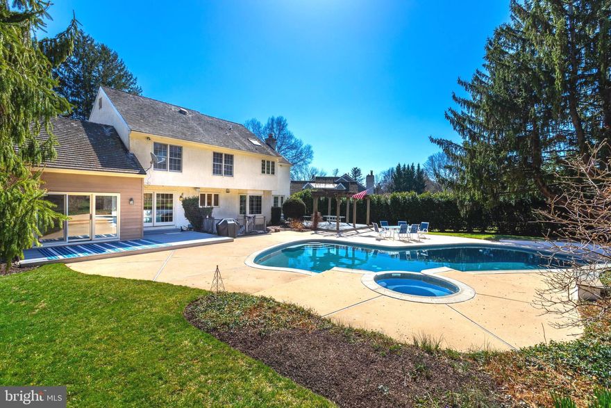 Location, Location, Location! Nestled atop a serene cul-de-sac on sought-after Rock Creek Circle, this stunning .77-acre property offers the ultimate private oasis. Situated in the top-ranked, award-winning Tredyffrin-Easttown School District, this meticulously maintained and professionally landscaped home features 5 bedrooms, 3.5 bathrooms, an oversized 3-car garage, and a secure backyard playground. The multi-tiered decks surrounding the pristine pool and spa create the perfect setting for entertaining—or simply unwinding. Imagine basking in the sun, firing up the hard-piped gas grill, filling up the cooler, and lounging in the hammock for an hour… or six! Step inside to a bright and airy open floor plan that seamlessly blends classic charm with modern design. At the heart of the home is a chef’s dream kitchen, custom-designed with premium Wolf and Sub-Zero appliances, solid wood cabinetry, marble countertops, a stunning tile backsplash, intricate millwork, and a spacious walk-in pantry. A coffee bar with a second sink and a large breakfast bar add both style and function. The kitchen flows effortlessly to the sun-drenched family room, complete with a stone fireplace, custom built-ins, and floor-to-ceiling windows—plus direct access to a composite deck overlooking the pool. For more formal gatherings, the living room offers a second fireplace, gleaming hardwood floors, and another walkout to a pergola-covered deck—ideal for outdoor dining. The first floor also boasts a private office, a stylish powder room, and a well-designed mudroom with full-sized laundry and storage. Upstairs, the primary suite features a massive walk-in closet and an elegant en-suite bathroom, while three additional spacious bedrooms share a large three-piece bathroom.
The finished lower level expands your living space with a fifth bedroom, third full bath, a custom bar, an expansive recreation area, and direct access to the backyard and pool. Ample storage and updated mechanical systems complete the space. This exceptional home is a rare find—don’t miss the chance to make it yours!