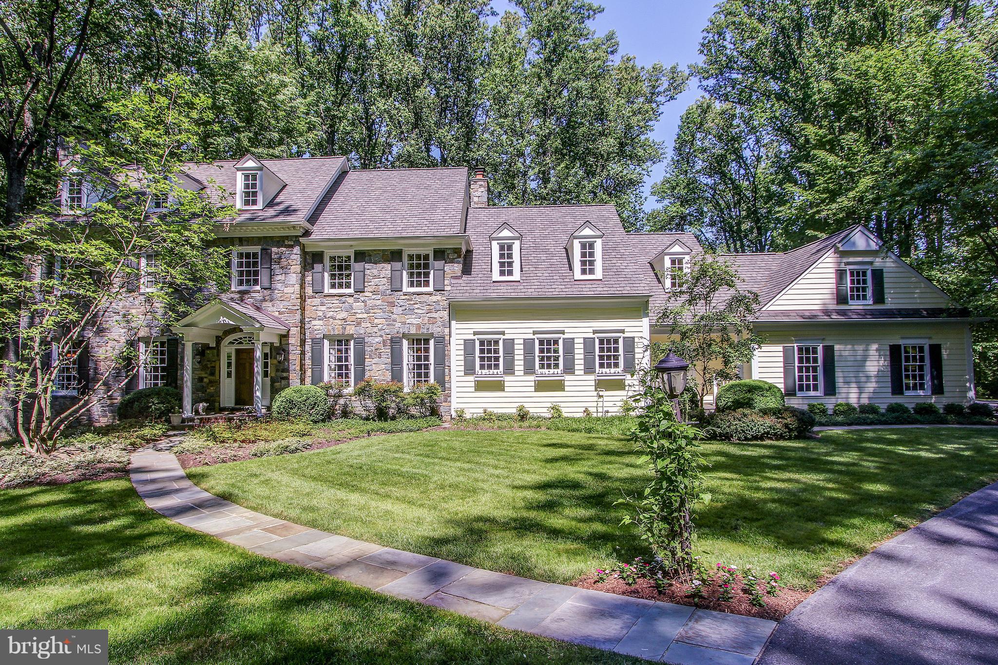 Custom Ted Visnic colonial. Refined, elegant & perfect for entertaining, Breathtaking wrap-around stone exterior, spacious interior with oversized rooms, high ceilings, grand foyer, dual staircases, gourmet kitchen, gorgeous Owner's suite & fabulous walk-out lower level. Beautiful1.5 acre wooded lot with veranda & magnificent patio.