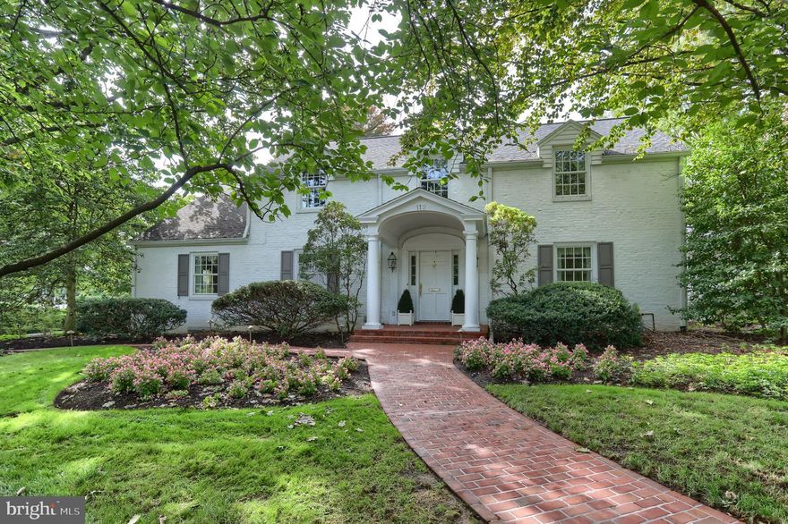 You know that one home that you've driven by hundreds of times over the years and always just admired and loved it?  Well, THIS is one of those homes, and here's your opportunity to make this rare treasure yours!  There's so much to love about this beautiful home nestled on a meticulously landscaped half acre, corner lot in a prime location in the village of Hershey.   Generously sized living and dining rooms boast gleaming hardwood flooring and crown molding.  Snuggle up with a good book in the  library with lovely built-ins, wood floors and a cozy gas fireplace.  You'll find loads of cupboard and counter space in the kitchen with a convenient pass-thru to the great room.  Your senses will positively engage as you enter the sun-splashed great room featuring high ceilings, loads of tall arched windows, a spiral staircase to the primary BR and  striking heated brick paver flooring.  Sit and bask in the natural light as well as entertain to your heart's content here!  The great room flows naturally across the back of the home into the sun room featuring the same beautiful flooring and an ELEVATOR.  Convenient first floor laundry off the kitchen.  On the second floor, the huge primary bedroom suite with French doors leading out to a balcony overlooking the great room features two walk-in closets plus other closet space, a sitting room, dressing room, and spacious primary bath with a large whirlpool tub, tile shower and double vanity.  Plenty of special features await your discovery as you tour this home.  Now, venture out from the great room onto a handsome brick walk leading to a a beautiful brick terrace  - ideal for entertaining or simply relaxing in mild weather.  Charming brick walkways meander around beautiful and colorful landscape beds all around the property - truly a gardener's paradise.  Add to all of this is an outstanding, super convenient location - walk to schools, pool, library, shops, restaurants and more.   Don't miss this rare opportunity to see this sweet treasure of a home.  Call now to arrange for a private tour!
