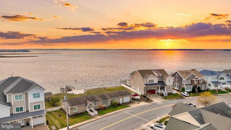 AUCTION! Own your own piece of paradise with this lovely beach cottage set upon a large bayfront lot in the Little Salisbury community in Ocean City. The house was built on 2 full lots and can be subdivided to build 2 homes. Enjoy the expansive views from your deck or your private dock with boat lift. The cottage has an open floorplan with large windows overlooking the bay. There are 3 bedrooms and 2 full baths, as well as a 1 car garage with extra storage space for your toys. The house can be expanded, and the lot has plenty of room to add a pool, outdoor kitchen and other amenities. No HOA! There is a community boat ramp and the home is just a short bike ride or walk to the beach. Opportunities like this rarely come along -- don't miss your chance! Property to be sold at Public Auction on Thursday August 8th at 2:00 pm. Auction to be held at the property. Offsite bidding available. List price is suggested opening bid. Actual price to be determined at auction.