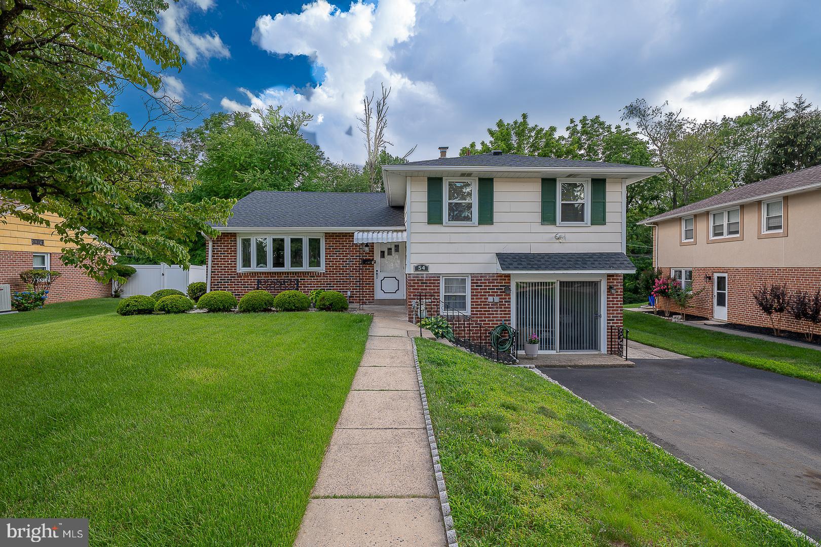 Professional Photos to Follow! Step into this beautifully maintained 3‑bed, 2.5‑bath split‑level classic at 54 , nestled in Cheltenham Township’s sought‑after Oak Lane Manor. Boasting 2,171 sq ft of thoughtfully designed living space on a generous lot, this home offers comfort, style, and easy suburban elegance . Bright and welcoming main level features a sunlit living room with bay window, dining area that opens into the updated kitchen . The remodeled kitchen features granite counters and stainless appliances , brand new refrigerator. This open floor plan is great for entertaining and everyday living! The dining room has French doors that open to a covered patio and beautiful grounds. Upstairs you will find a cozy main bedroom with walk in closet and ensuite main bath featuring a stall shower. Additionally there are two bedrooms and hall bathroom and access to attic storage. The lower level is great for entertaining ! The finished family room features built‑ins, an updated powder room, walk‑in cedar closet, laundry, extra storage, and sliding doors to the driveway. Two-car driveway plus ample yard space enhances everyday living and curb appeal . Easy access to the train, subway and Center City make this location a commuters dream location. Quick commute to 309, Turnpike ,476 area hospitals and Universities.