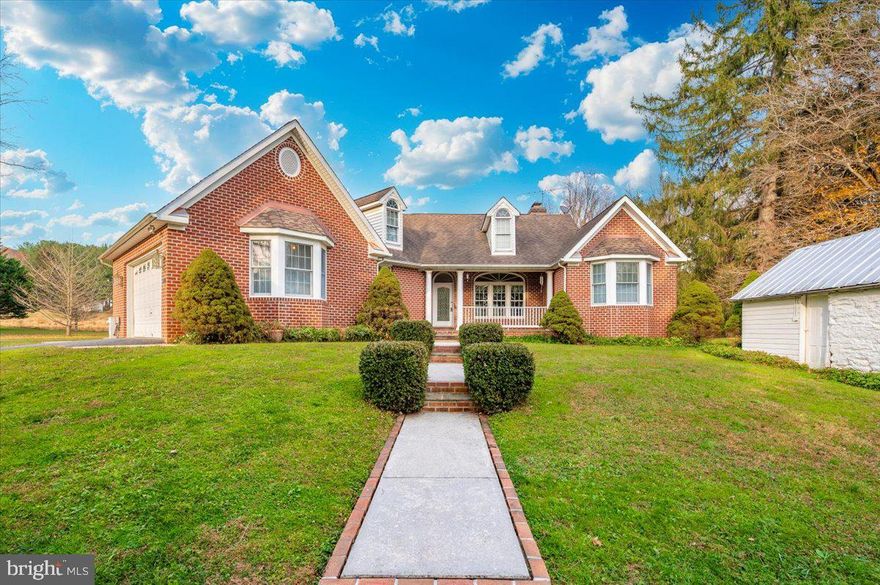 Just in time for the holidays!  You will be captivated as you drive down the private tree lined driveway of this 21 acre property.  Gorgeous farm views from every direction .  The old farm house was demolished in 2002 and a new all brick custom rancher was built.  A new septic was installed and new well producing 7 gallons a minute.  The floor plan is open with cathedral ceilings,  walls of windows, hard wood floors  and a stone masonry fireplace in the family room.  The kitchen showcases a full wall of cabinets and built in shelves for ample storage,  a wall oven, built in microwave and  gas (propane) stove.  A half bath is placed just off the kitchen for guest.    The owners suite is just around the corner with cathedral ceilings, double closets , large tile shower and a soaking tub.   At the other end of the home you will find a full bath and 2 more bedrooms.  The 9x30 screened back porch has walls of sliders, a slate floor and beautiful wood ceiling with 2 fans.    The basement is  partially finished with a 1/2 bathroom, second fireplace lots of rooms for storage or to finish up your dream home .  Stairs walk out into the garage.  The home is equipped with a central vac and hook up for a whole house generator.  The house is perfectly placed  on the 21 acres allowing for awesome views and functionality with the remaining out buildings. Buildings to include a beautiful bank barn,  drive through corn crib,  chicken house, hog barn, smoke house and other outbuildings. The rear of the property has about 3+/- acres of woods with trails to Morgan Run and large mature trees.  There is plenty of open land for fields of crops or pastures on both sides of the property. If you are looking a farm but don't want to fool with old house repairs! You have found your dream property.  The older owners spared no expense in quality and gentle used the home.  Call your favorite realtor today for a private tour.   This property is being sold to settle an estate.