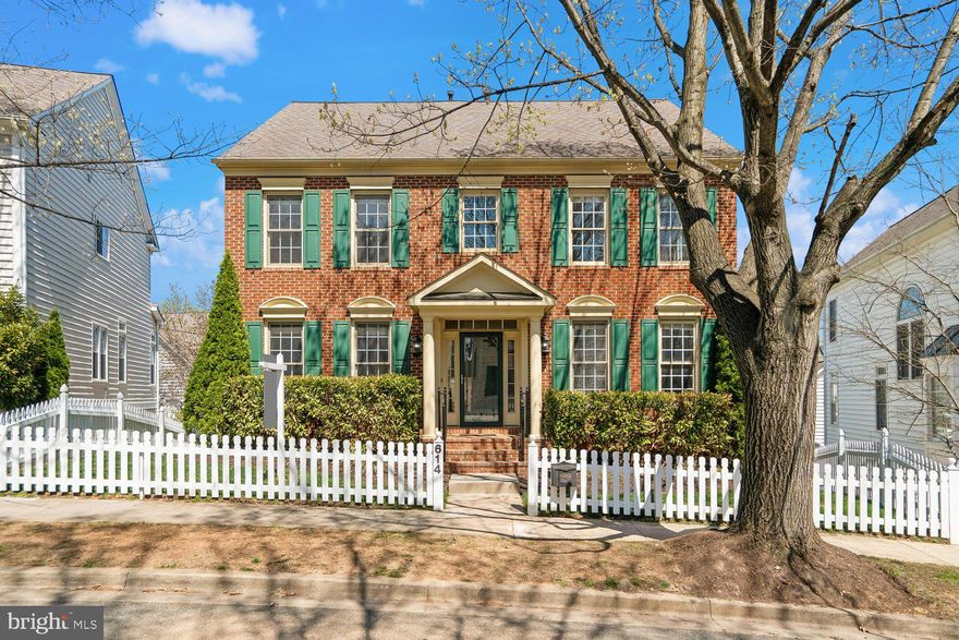 The Lakelands listing you’ve been waiting for! This beautiful brick-front home offers spacious living areas, fabulous flow, an ideal location, and a big, level backyard perfect for play, relaxation, and entertaining. Hardwood floors welcome you into the entry foyer, flanked by a private office with double French door entry and the gracious dining room with elegant moldings. The convenient butler’s pantry connects seamlessly to the spacious kitchen, featuring granite countertops, a large central island, updated appliances, and a generous pantry closet. The sunny breakfast area adjoins the kitchen as well as the mudroom/laundry room area, with a utility sink and extra cabinet storage – and offers access to the expansive deck. Just off the kitchen, the family room features recessed lighting and a stacked stone fireplace. An updated powder room and a coat closet complete the main level. Upstairs, the primary suite is a true retreat featuring a double-door entry, tray ceiling, crown molding, a lighted ceiling fan, and a large walk-in closet. The beautifully updated en-suite bath features custom tile, a glass-enclosed shower with dual shower heads and bench seating, custom cabinetry, built-ins, and a private WC. The three additional generously sized bedrooms include lighted ceiling fans and ample closet space, while second full bath is updated with custom tile, glass shower enclosure, double-sink vanity, and decorator lighting and fixtures. Highlights of the finished walk-out lower level include a large recreation room, a game room area, a bonus room with walk-in closet, and a third full bath beautifully updated with custom tile, glass enclosed shower, granite-topped vanity, and decorator lighting fixtures. This level also offers plenty of space for storage and direct access to the patio and back yard. Outside, enjoy the large deck overlooking an expansive fenced lawn and shaded patio bordered by blooming gardens. A paver walkway leads to the detached double-door garage with overhead rafter storage plus a parking pad with space for two additional cars. Ideally located on a picturesque street close to the countless shopping, dining, and entertainment options this sought-after neighborhood has to offer as well as to Lakelands Park Middle School and Lakelands state-of-the-art recreation facility, this home has it all!