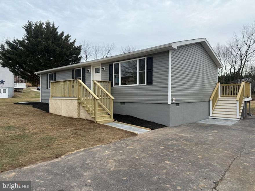 Welcome to this fully renovated 3-bedroom, 2-bath ranch style home in desirable Carroll Valley, PA, just a short walk to Lake Kay and Fairfield Area Schools. Situated on a half-acre lot, this 1,104 sq ft home offers modern comfort, energy efficiency, and truly move-in-ready living. Perfect for those looking to downsize or a starter home.
The open-concept layout seamlessly connects the kitchen and living room and features luxury vinyl plank flooring throughout. All-new drywall and fresh paint create a bright, modern interior. The spacious primary suite includes a walk-in closet and private en-suite bath with walk-in shower, while a second full hall bath with tub/shower serves guests or family.
The fully upgraded kitchen boasts brand-new cabinetry, granite countertops, an oversized sink with garbage disposal, and new stainless steel Whirlpool appliances, including refrigerator, microwave, electric range, and dishwasher. A Whirlpool washer and dryer are also included.
This home has been completely renovated from top to bottom. Exterior updates include new siding, doors, windows, a brand-new front deck, updated rear deck, and a roof replaced in 2019.
Major system upgrades include a Trane central air heat pump with a 10-year warranty, a Generac whole-home backup generator (installed in 2019 and recently serviced), all-new water systems (well pump, pressure tank, hot water heater, and whole-home filtration), new electrical, plumbing, subflooring, insulation, and smoke detectors. The conditioned crawlspace with dehumidifier (approx. 50” height) provides excellent storage.
Additional features include a 10’ x 16’ storage shed, public sewer, and private well water.
Ideally located less than one mile from Liberty Mountain Resort and Golf Course and minutes from Historic Gettysburg, this home offers rare, worry-free ownership in a highly sought-after location.