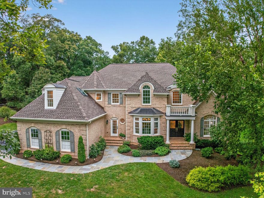 Beautiful, fully automated custom estate home with over 6000 square feet of living space boasts five bedrooms, 4.5 baths, a heated saltwater pool, and entertaining spaces galore. Meticulously maintained, this home is nestled on six private acres in Clifton’s prestigious Balmoral neighborhood. This home offers elegant living in one of Fairfax County’s most beautiful neighborhoods. The light-filled, airy interior features first-floor views of a private tree lined vista overlooking a heated saltwater pool designed with a stunning waterfall! Mature trees, and rolling hills combine luxury and nature in perfect harmony.

Many features prevail in this elegant home. Upon entering the beautiful two story foyer you are greeted by floor to ceiling windows looking out to a tree lined vista. The open concept gourmet kitchen, in the French Provincial style, features stainless steel appliances including Viking, Bosch and Fisher & Paykel. The adjoining two-story family room is complete with a fireplace and a wall of windows that flood the room with sunlight. The adjoining formal dining and living room are spacious in size and filled with natural sunlight; both have open space views adorned with trees. The primary suite offers two walk-in closets, and a large sitting room. The primary bath has elegant natural colored marble and a soaking tub for that spa-like feel. Two upper level bedrooms feature a Jack & Jill bath. The fourth bedroom is complete with an En-suite full bath.

The spacious lower level walk-out has custom built-ins, crown moldings, a fireplace and a wall of windows that fill the space with natural light. An adjoining light filled in-law suite has a private full bath, and a wet bar area with a refrigerator. Additional spaces complete the lower level including a craft or work area as well as a huge storage area that can be converted for many purposes.

The owners have meticulously cared for this home throughout. Fully automated, the owner maintains complete control over all lighting, pool controls, HVAC, home security, irrigation and more. The HVAC, hot water heater, roof, gutters, and pool deck have been replaced alongside other updates. The oversized garage measures approximately 23 by 35 and is another fine feature of this quality custom home.

Any buyer, driving through Balmoral, will be in awe of the tranquil setting of the neighborhood. Balmoral Greens borders  Bull Run Regional Park and Westfields Golf Course. The golf course, designed by Fred Couples, adds to the high end appeal of the neighborhood. For horse lovers, 18 miles of horse trails run behind the home and extend into Fountainhead Park. 

There is no other setting like this in all of Fairfax County. This home is a must see.