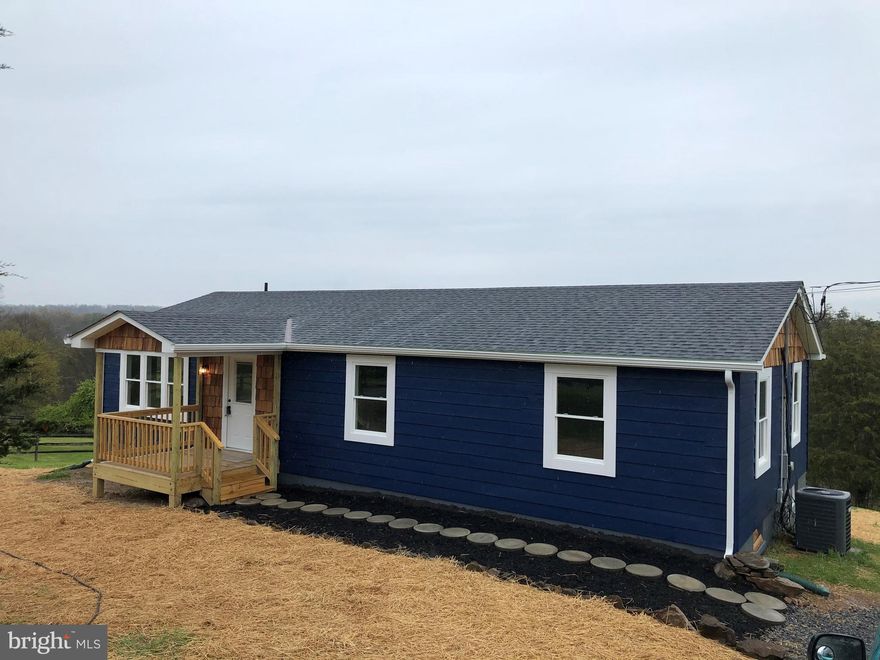 Beautifully renovated rancher with views you don't want to miss from the back deck. Just minutes from the VA line this home has been completely updated and is move in ready! One level living with a completely finished basement for some extra entertaining space.  Schedule today!