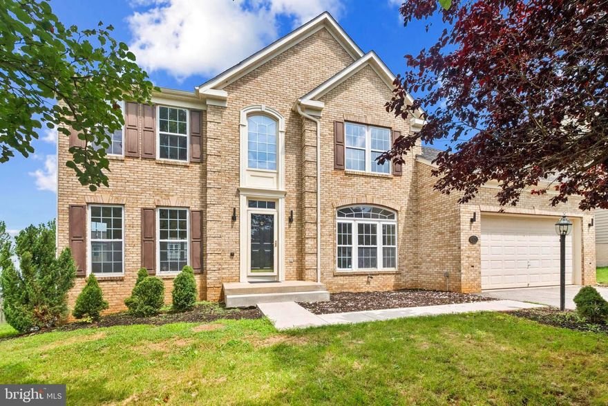 This spacious 3-story brick-front colonial has everything you’re looking for—inside and out! With 4 bedrooms, 2 full baths, and a half bath on the main level, there’s plenty of space for comfortable everyday living. 
The main level features a light-filled open layout with fresh paint, new floors, and a stunning kitchen that’s been completely redone with white shaker cabinets, quartz counters, stainless steel appliances, and a sleek center island. Off the kitchen, Upstairs, all 4 bedrooms are carpeted, including the spacious primary suite with a large sitting room/den and ample storage. The primary bath includes a soaking tub and separate glass-enclosed shower, and there's a second full bath down the hall for the other bedrooms. 
The family room on the main level is bright and welcoming, with cozy carpet and a fireplace as the centerpiece. Downstairs, the walk-out basement is unfinished and ready for your personal touch. A 2-car attached garage and, 2-car driveway make parking and storage easy. 
With fresh landscaping and a large open backyard, this home blends upscale living with everyday ease. Come see it for yourself!