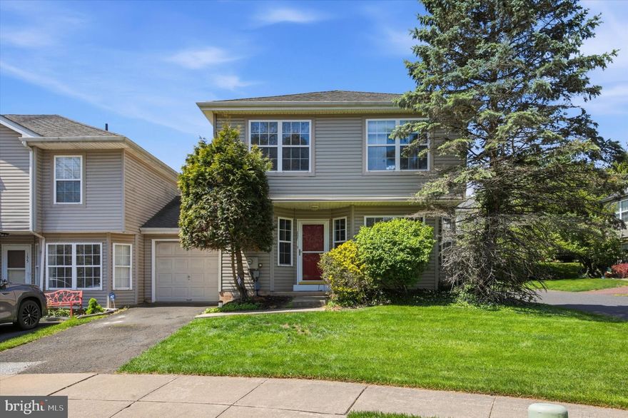 Don't skip seeing this rare find - an end unit with a garage in the desirable neighborhood of Lindenfield!  Featuring 3 bedrooms and 2 1/2 baths, hardwood and tile floors, this home has so much to offer.  Walk into the spacious foyer and to the right you will find the equipped kitchen which has a breakfast bar and separate eating area.  A stainless steel fridge and dishwasher and range with built-in microwave (all newer) round out this room.  The massive living room has easy-clean tile floor plus a vaulted ceiling with ceiling fan and two sets of French doors leading to the rear paver patio.  A convenient powder room is also located on this level. Don't forget the vast storage area under the stairs. Upstairs you will find a primary suite with large walk in closet and bath with shower stall.  Two other bedrooms plus the hall bath with laundry complete the second floor.  The floored attic offers even more storage area and has drop-down stairs and lighting.  This home also has a one-car garage with inside access.  The house faces the scenic woods and is walkable to North Branch Park plus about one mile away from Peace Valley Park,  Lake Galena plus the Septa train station.  Top-rated Central Bucks schools complete the picture.