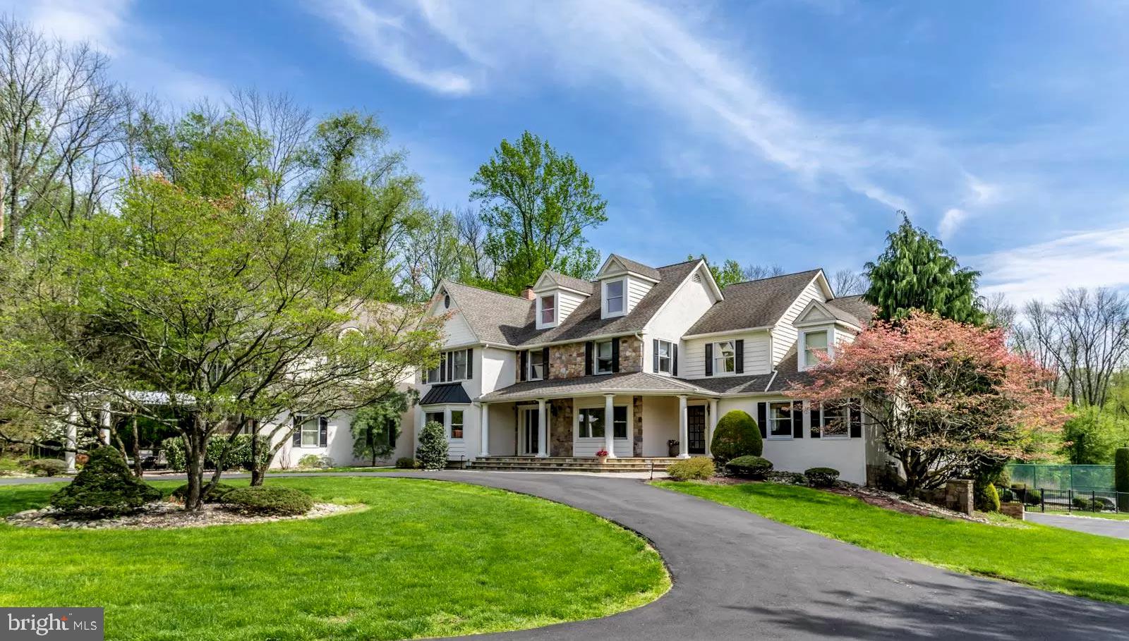 Custom-Built Estate & Carriage House on 11.8 Acres in Peaceful Ivyland, Bucks County Be instantly immersed in tranquility as you drive beyond a gated entry, through an impeccably manicured tree-lined drive, only to find a custom-built estate waiting for new owners to enjoy. Priced under appraised value, this 6-bedroom, 5-full, and 2-half bath, is detailed from top to bottom, inside and out, with upgrades ready for new owners to love. Revel in the home's intricate design details and show-stopping features, including an inground pool, tennis court, movie theater, steam shower, a true major league baseball infield, bating cage, multi-level outdoor deck, two gazebos, attached 3-car garage, and newly renovated kitchen sure to please any cook. The kitchen, complete with an extended island, granite countertops, double ovens, sub-zero fridge, Wolf 6 gas burner range, butler s pantry, and farmhouse sink, leads to a delightful family room, featuring vaulted ceilings, elegant fireplace, and French doors, opening to one of multiple seating rooms overlooking the exquisitely maintained grounds. On the upper level, you ll find 3 large bedrooms, full bath, and master bedroom that promises to be an oasis for the home s owners with a stately fireplace, glass-block walk-in shower, and double vanity. The luxury continues on the walk-out lower level, where you ll find an entertaining space, full bath, kitchenette, and gym, plus second office. Detached from the home, you and your guests will appreciate the privacy of a carriage house, complete with kitchen, living area, bedroom, and bathroom. Located close to prominent pre-school, Rainbow Academy for Little Scholars, and with countless distinguishing features, you and your family will find everything you need and more for a well-rounded and rewarding life in revered Bucks County, PA. Prior to all showings a pre-approval must be submitted to the listing agent.