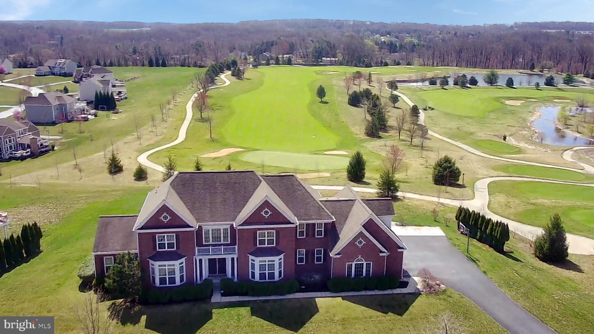 This “House on the Hill” is the pride of Applecross Country Club!
Located in the gated Estates section of Applecross, this Saint Regis model is the largest offered by Pulte and offers premium luxury and square footage!
The prime location of this property cannot be understated—this property offers superb golf course view, overlooking and directly adjoining the beautiful picturesque 12th green of the Applecross Country Club golf course! This is the best view in all of Applecross!!
The grand curved staircase greets you as you enter the soaring two-story foyer, with the gorgeous hardwood floors extending throughout the entire first floor and drawing you further into the home.
The adjoining dining room is spacious and features a tray ceiling and shadowboxed wainscoting and expanded crown molding—another premium feature you’ll find throughout the home.
A step-down parlor offers panoramic views and offers additional flex space and connects with the spacious first-floor study.
The expansive kitchen boasts a massive center sit-at island with glistening granite countertops that are featured throughout the kitchen, perfectly adorned by a tile backsplash. Equipped with premium stainless-steel appliances, this kitchen will be a hit for the chef of the family! An eat-in breakfast area is surrounded by windows, offering breathtaking views of the golf course.
The centerpiece of this home is the magnificent two-story family room featuring deep coffered ceilings and a wall of windows that bathe the area in natural light and offer the absolute best view of the golf course! A cozy gas fireplace completes the ensemble with perfect evening ambiance.
The rear of the home is literally covered in windows, along with the sprawling 1,386 sq ft two-tier entertaining-size hardscaped rear patio made from real stone and Travertine pavers.
The expansive fully finished basement itself is over 2,700 square feet of additional living space and includes a bedroom and full bathroom. Complete with a wet kitchenette area and many areas for storage, this area is a real premium!
Upstairs, you’ll find French doors leading to the master bedroom suite that boasts a deep tray ceiling with crown molding, as well as a wall of floor-to-ceiling windows overlooking the rear hardscaping and golf course! Architectural pillars separate a sitting area, with additional French doors opening to the step-down master bathroom with a cathedral ceiling, tile flooring, and pillars on either side of the elevated soaking tub. His-and-her vanities and the oversized stall shower complete the ensemble.
Three additional bedrooms round out the second floor, each with their own private bathroom.
The location is perfect as this home provides an easy walk to the pools, fitness center, and additional Applecross amenities! Applecross is conveniently located near several parks, shopping & restaurants, and located near major travel routes. Enjoy the award-winning Downingtown School District and take advantage of all that Applecross offers: A state-of-the-art fitness center and the -Studio T- exercise/dance studio, indoor and outdoor pools, Caribbean pool bar, Nicklaus-designed golf course, tennis, fitness classes, social events/parties, full restaurant/bar, family events, basketball and more! Applecross - Live Where You Play! This is a must-see home.