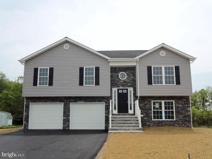 Welcome to The Vineyards! This sought-after community offers a prime commuter location with the perfect blend of comfort and convenience. The main level features a spacious master bedroom with en-suite bath, plus two additional bedrooms and a full guest bath. Enjoy an open-concept living room, dining area, and a fully equipped kitchen ideal for entertaining.

Nestled on nearly a half-acre corner lot backing to trees, this home offers privacy and outdoor living with a large back deck. Additional highlights include a two-car garage and a finished lower level with stylish luxury vinyl plank flooring.