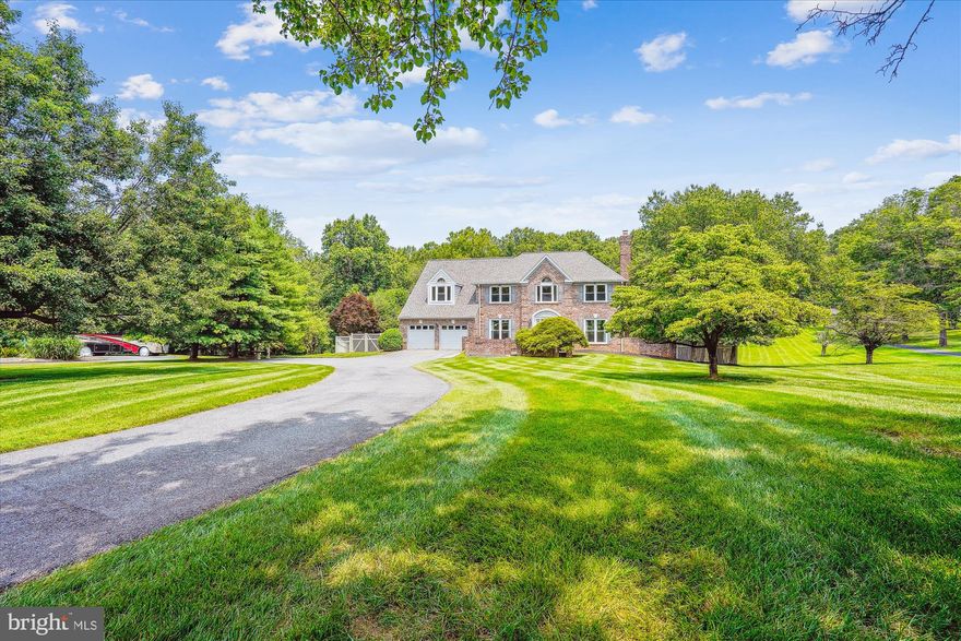 This is an ESTATE-Presenting this custom-built residence (constructed in 1987) located in Needwood Knolls, featuring three sides brick and brick to grade. The home is set on over two acres, directly backing to Rock Creek Park—providing both privacy and tranquility, convenient access to routes 370/270/200, local restaurants and golf courses. This 5,800 square feet of spacious, light-filled interior is designed for both comfortable living and elegant entertaining. Adjacent to the kitchen, a striking sunroom opens onto a Trex deck, overlooking the swimming pool and landscaped grounds—ideal for relaxation or hosting gatherings.
 Interior features include a formal living room with fireplace, dining room, den, family room with fireplace, kitchen, laundry room, sunroom, five bedrooms, four and a half bathrooms, a recreation room with fireplace, wet bar area, flex room, utility room, and a two-car garage. 
Recent replacements and updates include the roof, skylights, attic fans, siding, gutters and downspouts, front door, garage doors, Liftmaster openers, exterior lighting, Trex deck, retaining walls, both HVAC systems, hot water heater, and many windows. The swimming pool has been renovated and has been outfitted with an automatic cover.  Estate AS IS