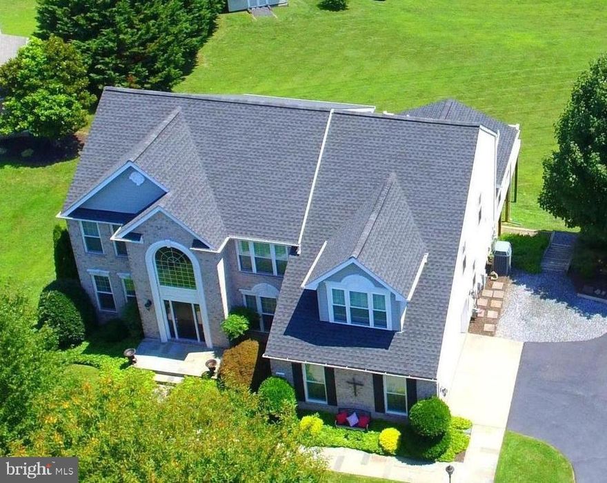 Impeccable Colonial in sought after Maxa Meadows.  Meticulously maintained 4 bed. 3 1/2 bath home with an abundance of natural light.  Balcony overlooks two story family room with gas fireplace.  It opens to kitchen and large sunroom/breakfast room addition.  Professionally landscaped 1.32 acre lot backs to a natural resource area.  Flagstone walkway and front porch.  Amenities galore!  Spacious primary bedroom with sitting area and paneled glass doors to primary bath.  Owners finished basement in 2004 for a spacious rec room.  Large addition in 2019 does not show on sq. footage on tax record.  When addition was built by Kris Konstruction, kitchen was totally remodeled with all new cabinets, granite countertops, high end appliances, island, breakfast bar, designer lights, etc.  At the same time hardwood floors were added on the main and upper level. and all back windows were replaced. Gas fireplace was also replaced in 2019.  Washer and dryer purchased in 2019 were not installed until 2021. Front windows replaced in 2016.  Other updates, Roof 2016, Shed roof 2022, HVAC 2018, HWH 2016, Well pump 2020, Water Softening System 2017, Primary bath and LL bath remodeled 2012, Porch and sidewalks 2016 and radon remediation 2015.   Many rooms freshly painted with neutal colors. Customs features  and quality throughout makes this feel like a brand new home.