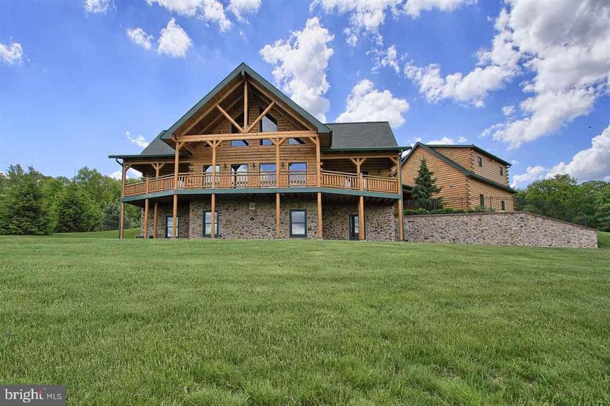 Spectacular, one of a kind log home w/breathtaking views on a glorious mountainside w/15 acres! 2 DET garages; one w/a 2nd floor guest/in-law accommodations & the other is 30'X50' w/room for toys or horses! Top of the line KIT appliances. Luxurious pool area w/salt water pool, pool house, granite topped bar & 1/2 bath. Wildlife is plentiful here & on adjacent properties. Loft in main house could be used as an additional BR.