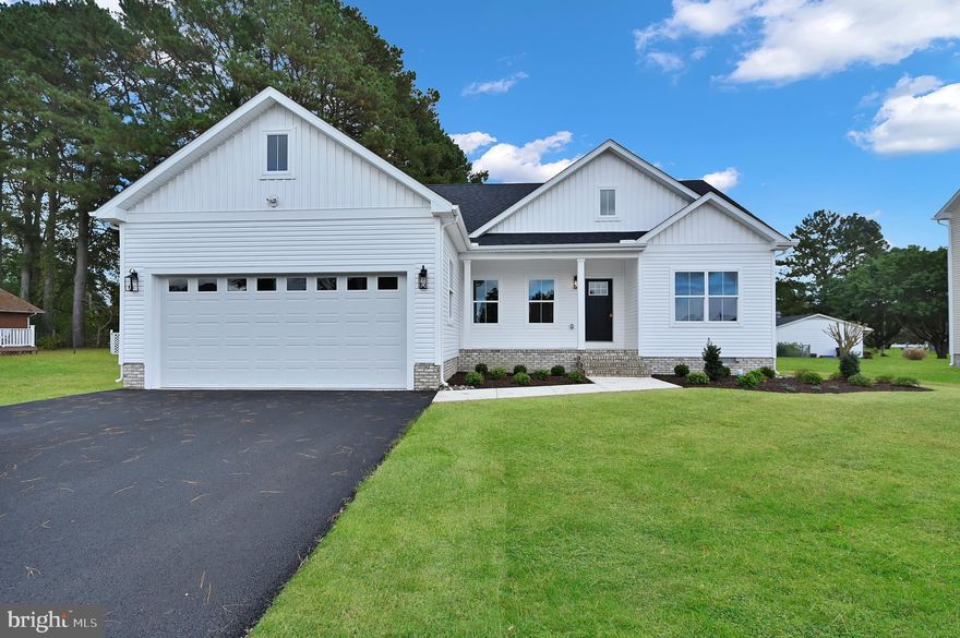 Welcome to this brand new 3-bedroom, 2-bathroom home in the desirable Holly Hill community of Fruitland, MD, with an annual HOA fee of just $375. This thoughtfully designed home offers an open floor plan perfect for modern living. The kitchen features a spacious island, Fabuwood cabinets with self-closing drawers, quartz countertops, stainless steel appliances, and a walk-in pantry with custom wood shelving. The primary suite is spacious and private, while two additional bedrooms share a full bath with a convenient tub/shower combo. All closets throughout the home are outfitted with wooden shelving, adding both quality and function. The attached two-car garage is equipped with an insulated garage door for comfort and efficiency. Interior upgrades include a trim package with Craftsman-style trim and doors, stylish Ledo door handles, and durable LVP flooring backed by a manufacturer lifetime warranty. On the exterior, you’ll find Certainteed siding, IKO Cambridge Lifetime shingles, MI V3000 Series windows, an upgraded exterior lighting package, and a beautifully landscaped bed package. This quality-built home combines style, durability, and convenience in a prime Fruitland location. Don’t miss your opportunity to make it yours!