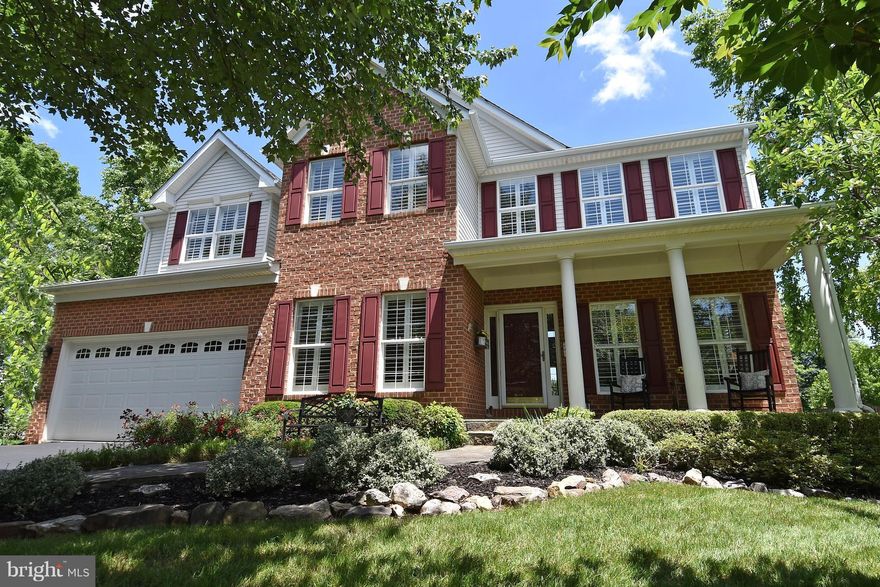 Beautifully maintained! Minutes to Historic District. 3-finished levels w/ bright & open floor plan. 2-story great rm w/soaring brick FP, gourmet kitchen, elegant DR/LR. HW floors on main & upper levels. Plantation shutters & custom trim. Rec Rm on LL can also serve as au-pair/in-law suite. Deck opens to patio, pond, private fenced yard w/ extensive landscaping.ROOF 2014 & HVAC/H2O HEATER 2012.