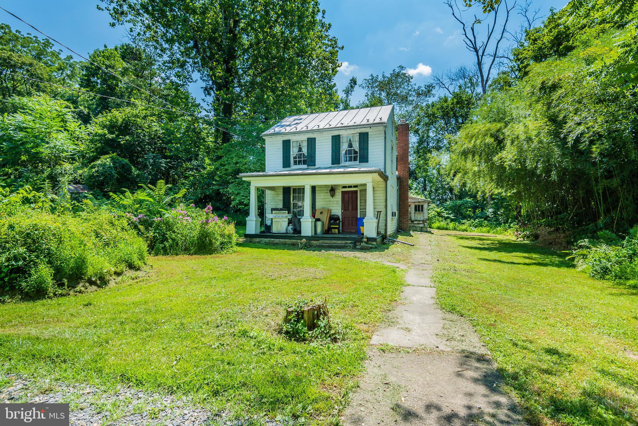 What a fantastic retreat! This 1790 farmhouse on over 2 acres bordering the Yellow Breeches is in a very private setting including 2 barns, and much more!